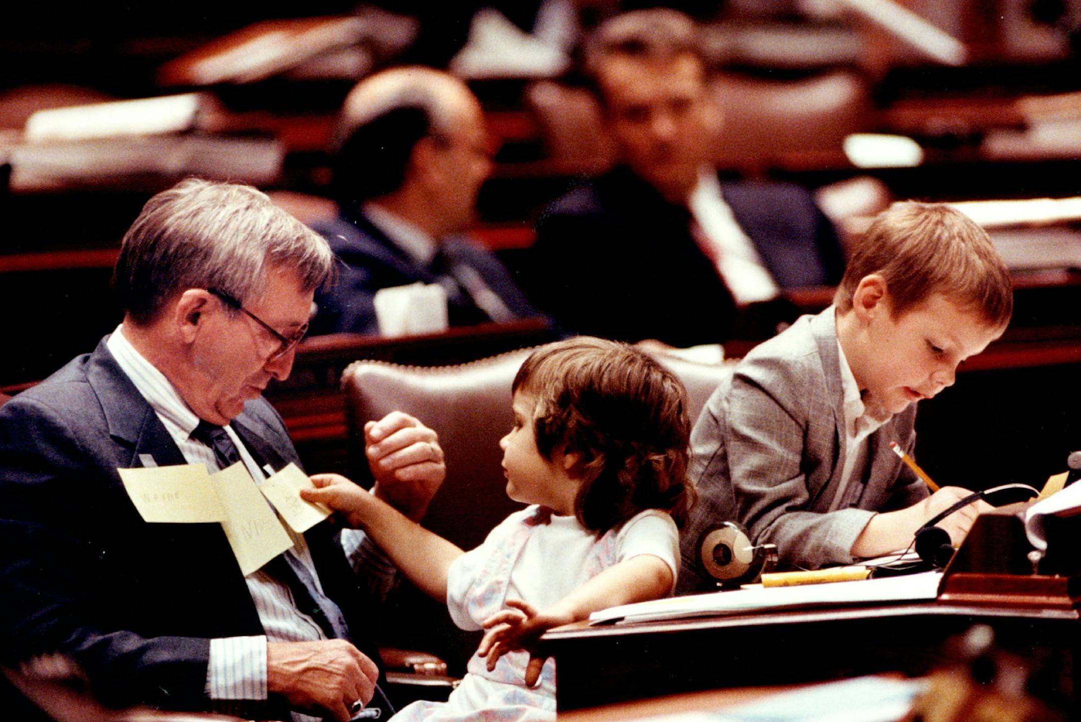 May 19, 1991 Rep. - Wayne Simoneau, DFL - Fridley, entertained his grandchildren Lindsey, 4, and Blake, 6, at the start of Saturday's House session. May 18, 1991 Jeff Wheeler, Minneapolis Star Tribune ORG XMIT: MIN2016051810554421