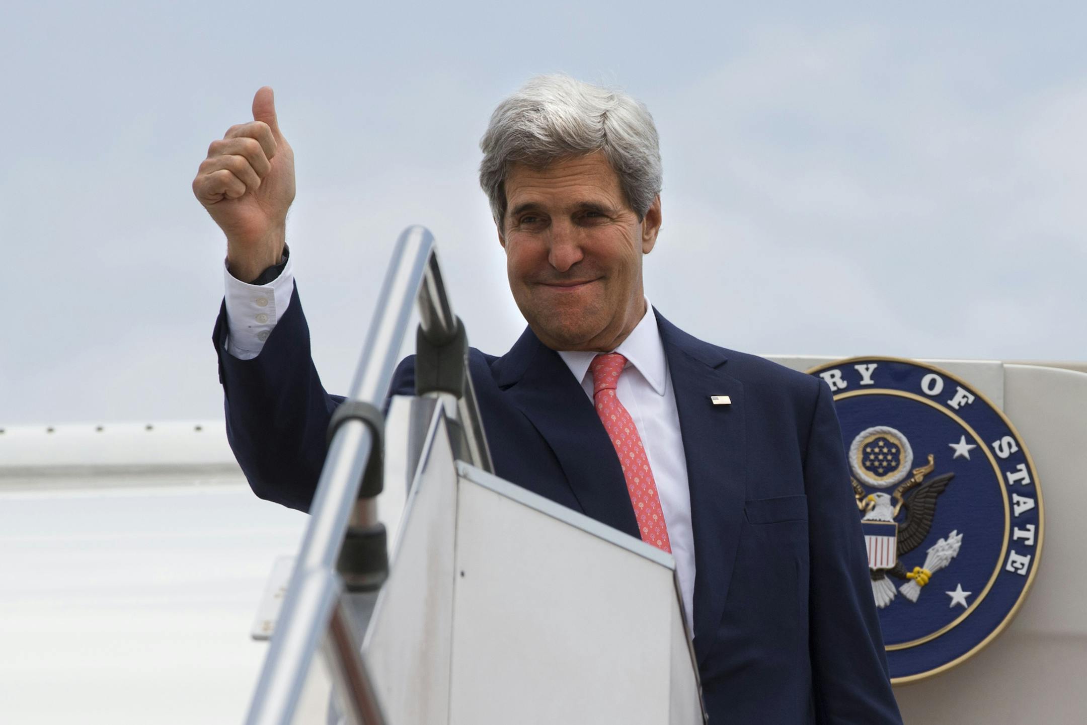 U.S. Secretary of State John Kerry makes the thumbs up sign as he leaves Malaysia from Subang TUDM outside of Kuala Lumpur, Malaysia, on Friday, Oct. 11, 2013, completing his trip to Malaysia after U.S. President Barack Obama cancelled his trip to the region due to the U.S. government shutdown. (AP Photo/Jacquelyn Martin, Pool)