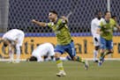 Seattle Sounders' Cristian Roldan (7) celebrates a Sounders goal late in the second half of an MLS playoff Western Conference final soccer match again