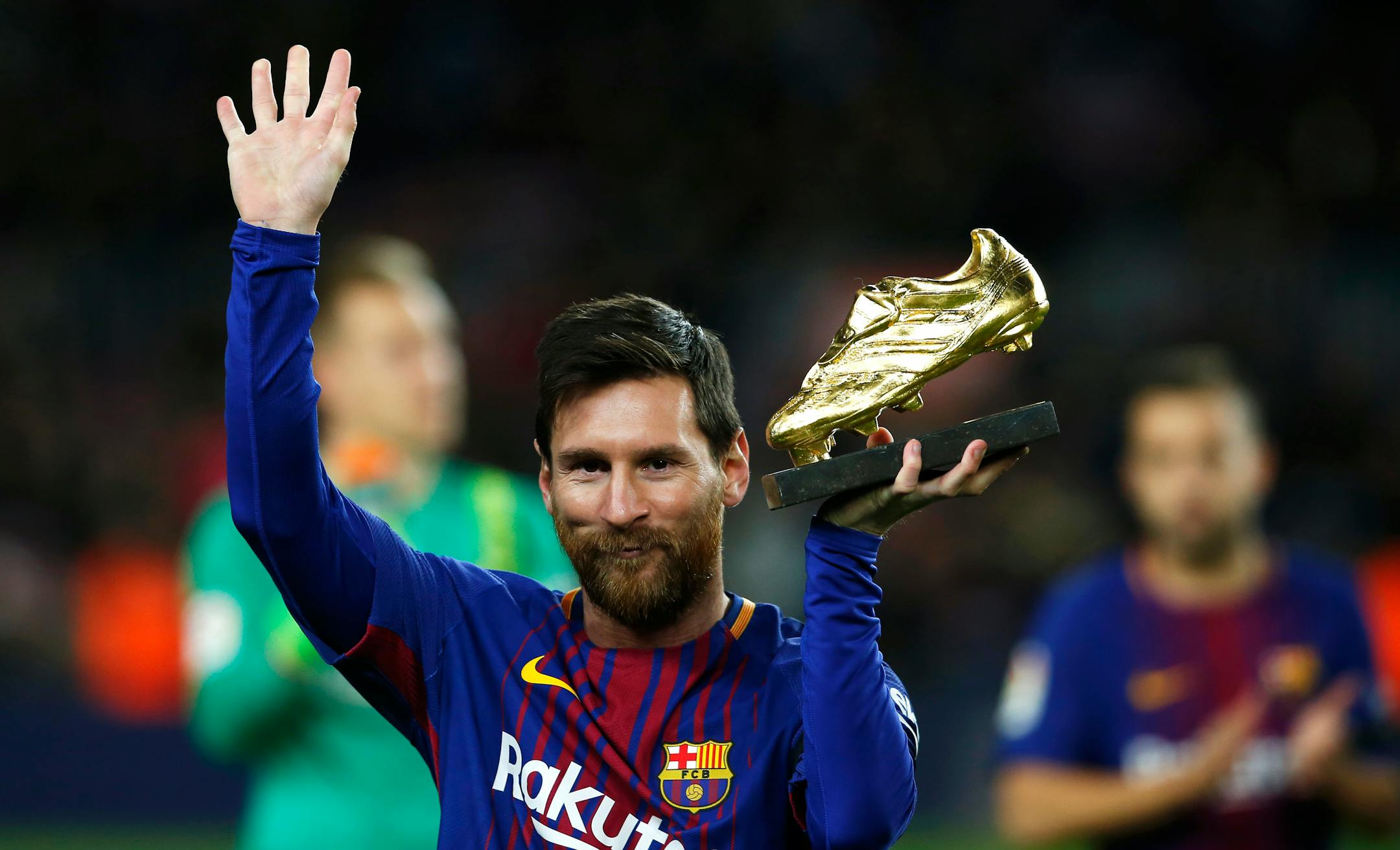 FC Barcelona's Lionel Messi holds up the Golden Shoe award, as the last season's leading goalscorer in league matches from the top division of every European national league, prior of the Spanish La Liga soccer match between FC Barcelona and Deportivo Coruna at the Camp Nou stadium in Barcelona, Spain, Sunday, Dec. 17, 2017. (AP Photo/Manu Fernandez)