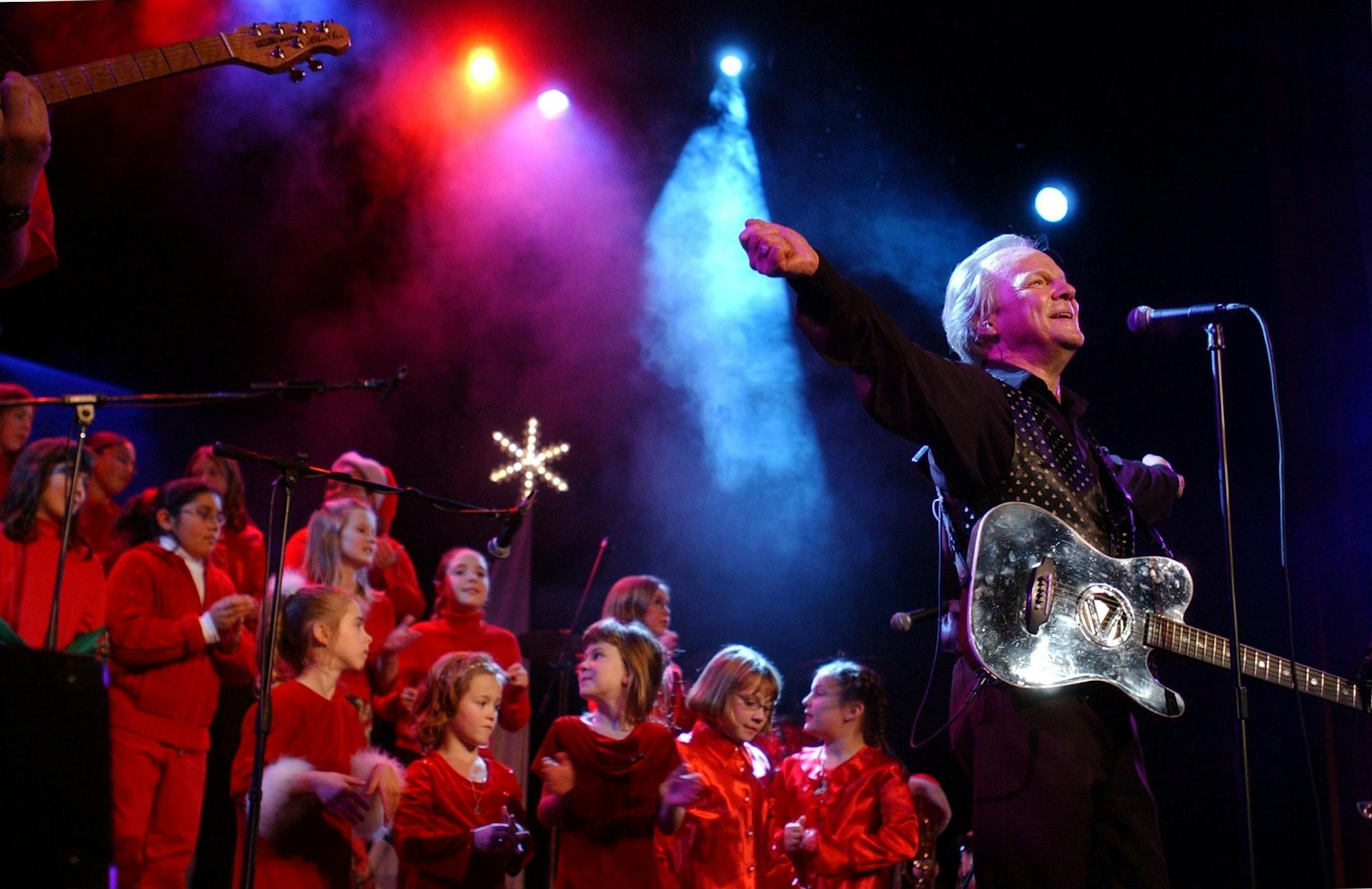 Dec. 3, 2004 -- Bobby Vee presented his "Up North December" concert in Fargo,N.D. On stage are elementary school students from St. Joseph's School in Moorhead, Mn. who sang with Vee on some songs.