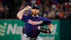 Minnesota Twins relief pitcher Sam Dyson throws to the Texas Rangers in a baseball game in Arlington, Texas, Friday, Aug. 16, 2019. (AP Photo/Tony Gut