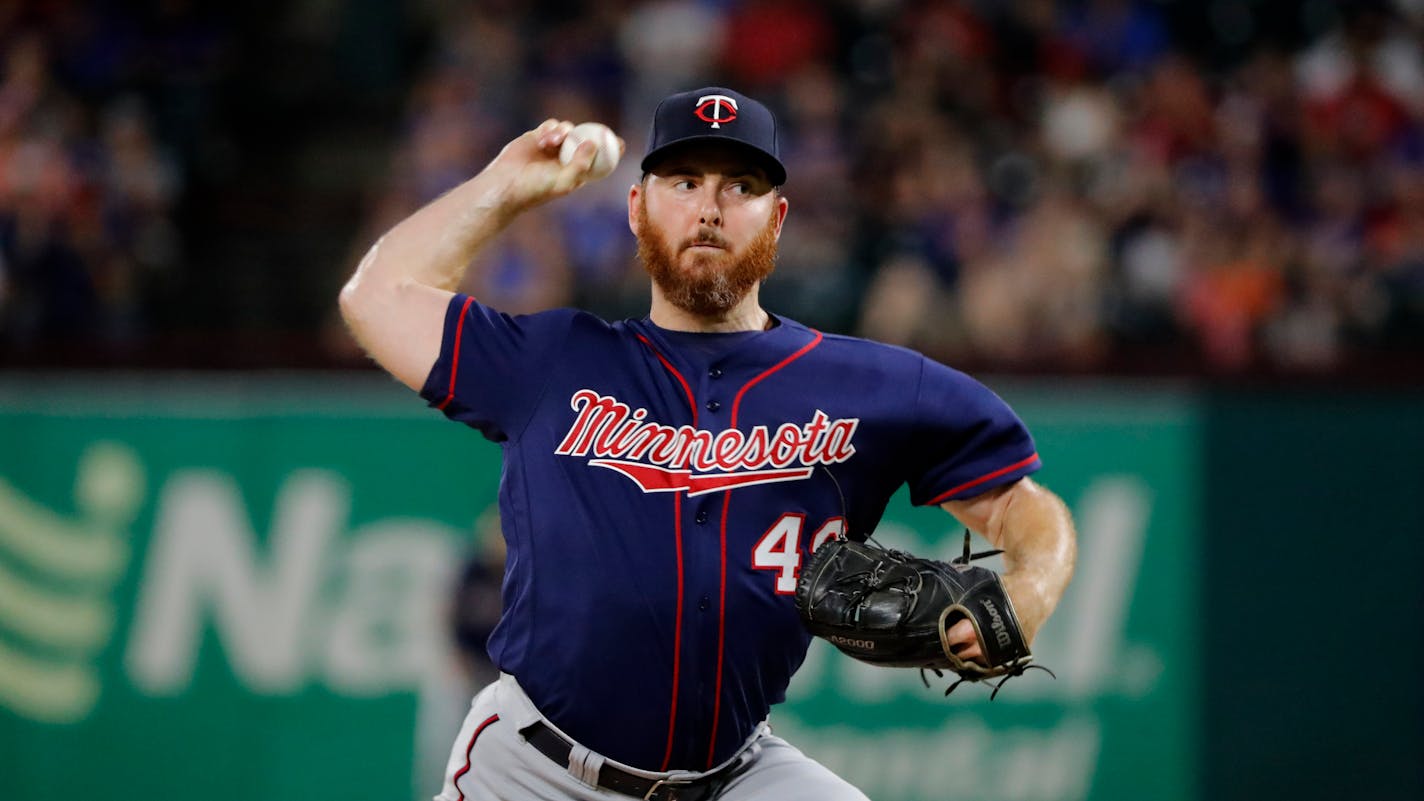 Minnesota Twins relief pitcher Sam Dyson throws to the Texas Rangers in a baseball game in Arlington, Texas, Friday, Aug. 16, 2019. (AP Photo/Tony Gutierrez)