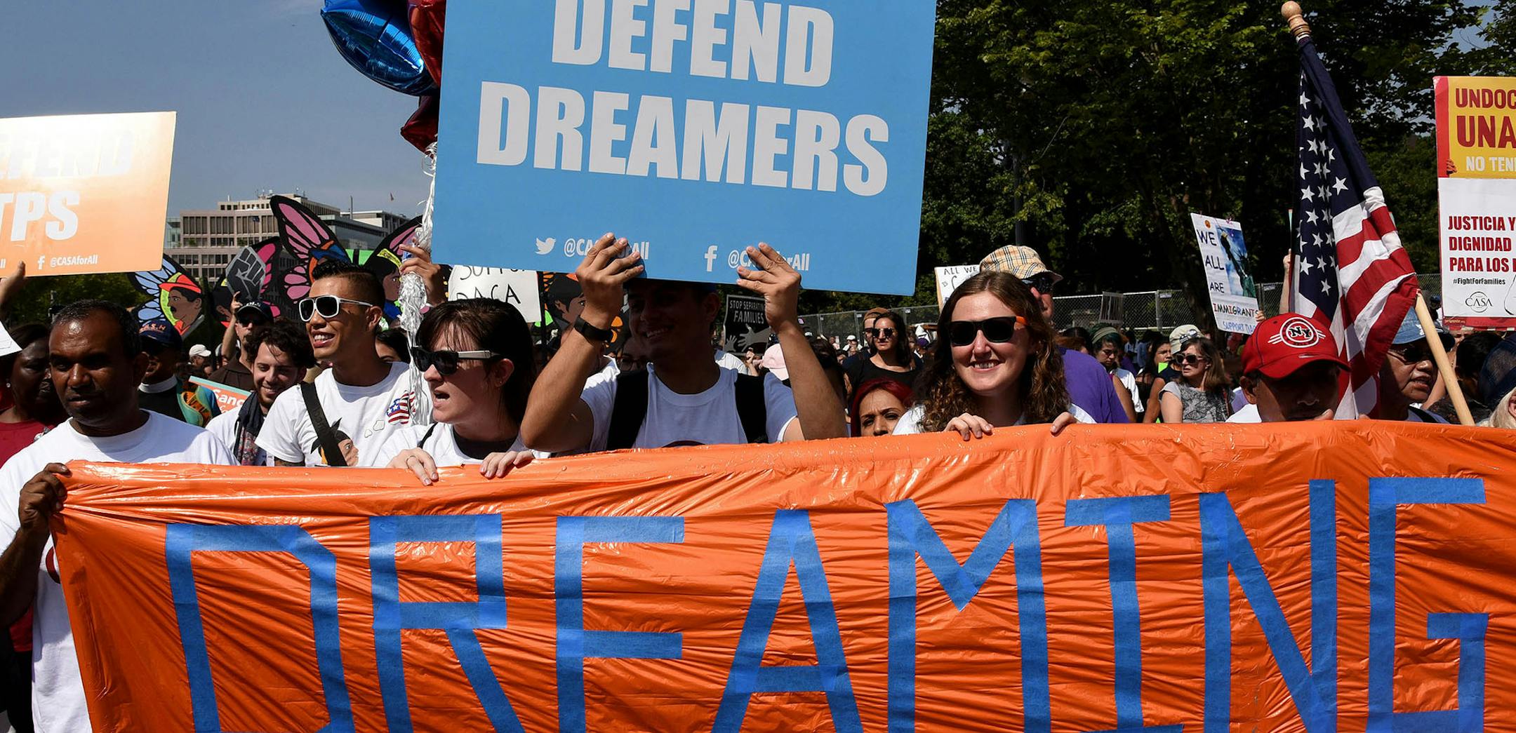 Protesters hold up signs during a rally supporting Deferred Action for Childhood Arrivals, or DACA, outside the White House on September 5, 2017. Thousands are expected to gather for rallies on Tuesday, when President Trump is slated to announce the future of the program. (Olivier Douliery/Abaca Press/TNS) ORG XMIT: 1210309 ORG XMIT: MIN1709051210211174