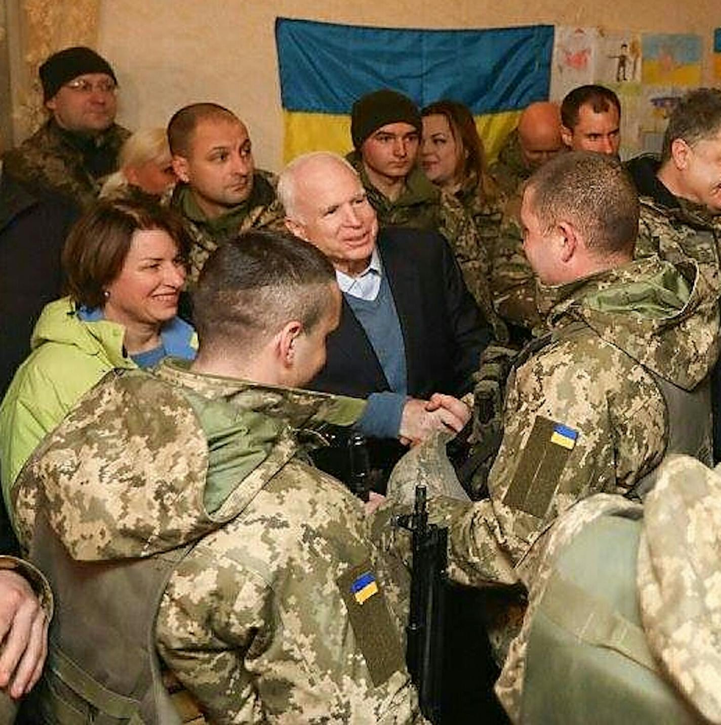 Sens. Amy Klobuchar and John McCain meet with Ukrainian marines in Mariupol in December 2016.