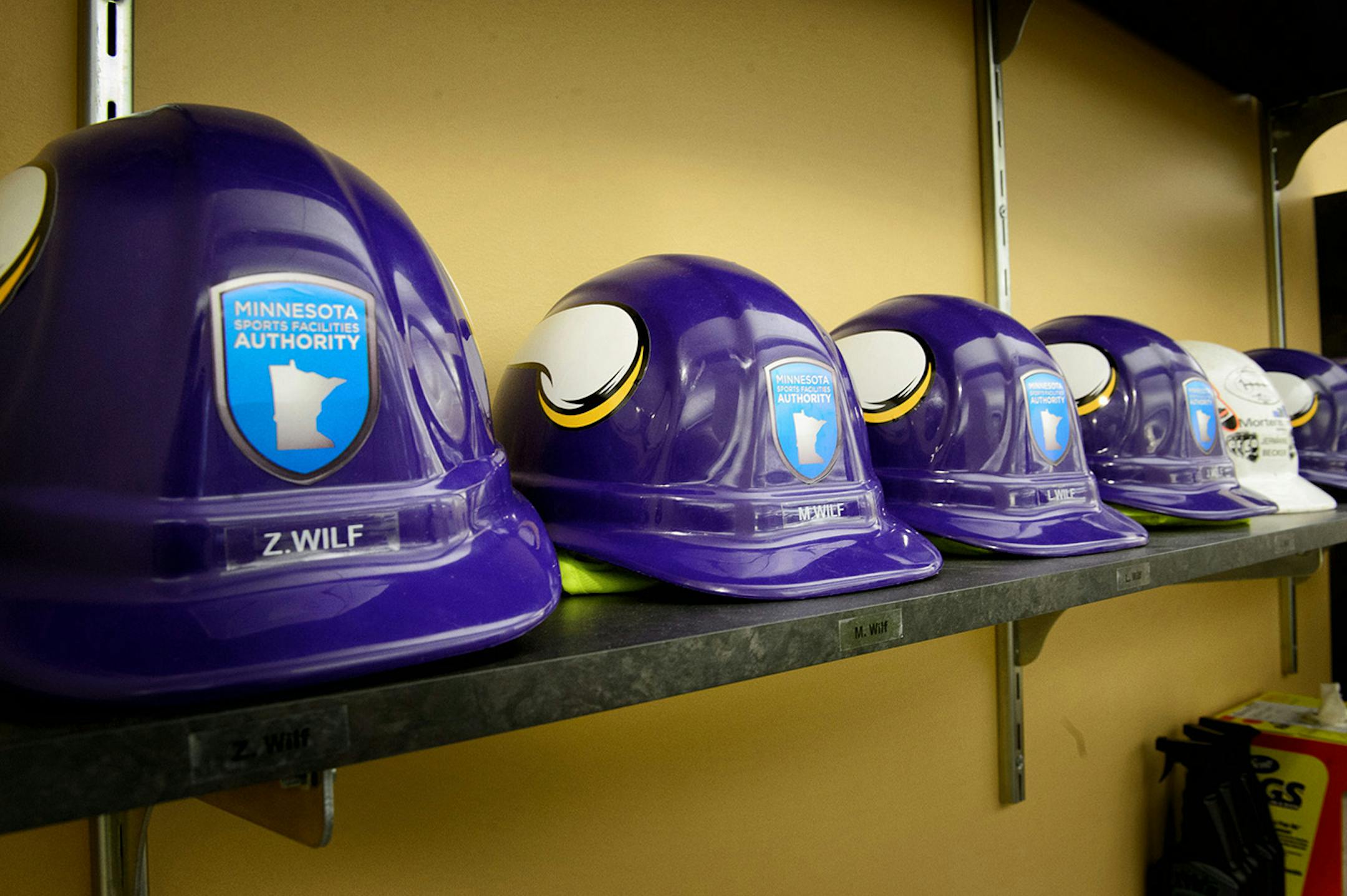Vikings construction helmets in the Vikings Minneapolis headquarters for each member of the Wilf family.
