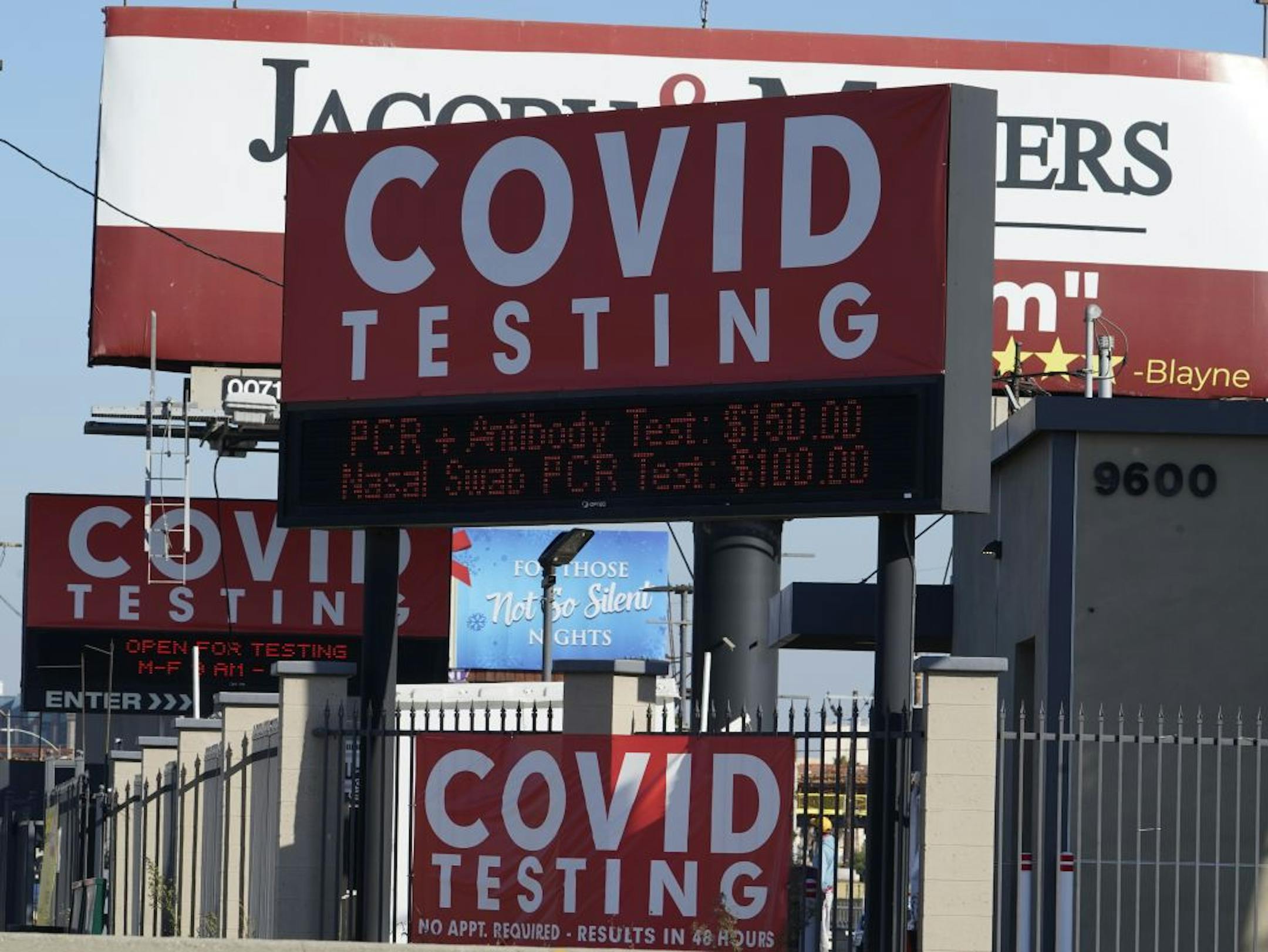 Advertisements for Covid-19 testing ares posted outside Los Angeles International Airport in Los Angeles, Friday, Nov. 13, 2020. California has become the second state to record 1 million confirmed coronavirus infections. The governors of California, Oregon and Washington issued travel advisories Friday, Nov. 13, 2020, urging people entering their states or returning from outside the states to self-quarantine to slow the spread of the coronavirus, California Gov. Gavin Newsom's office said. The