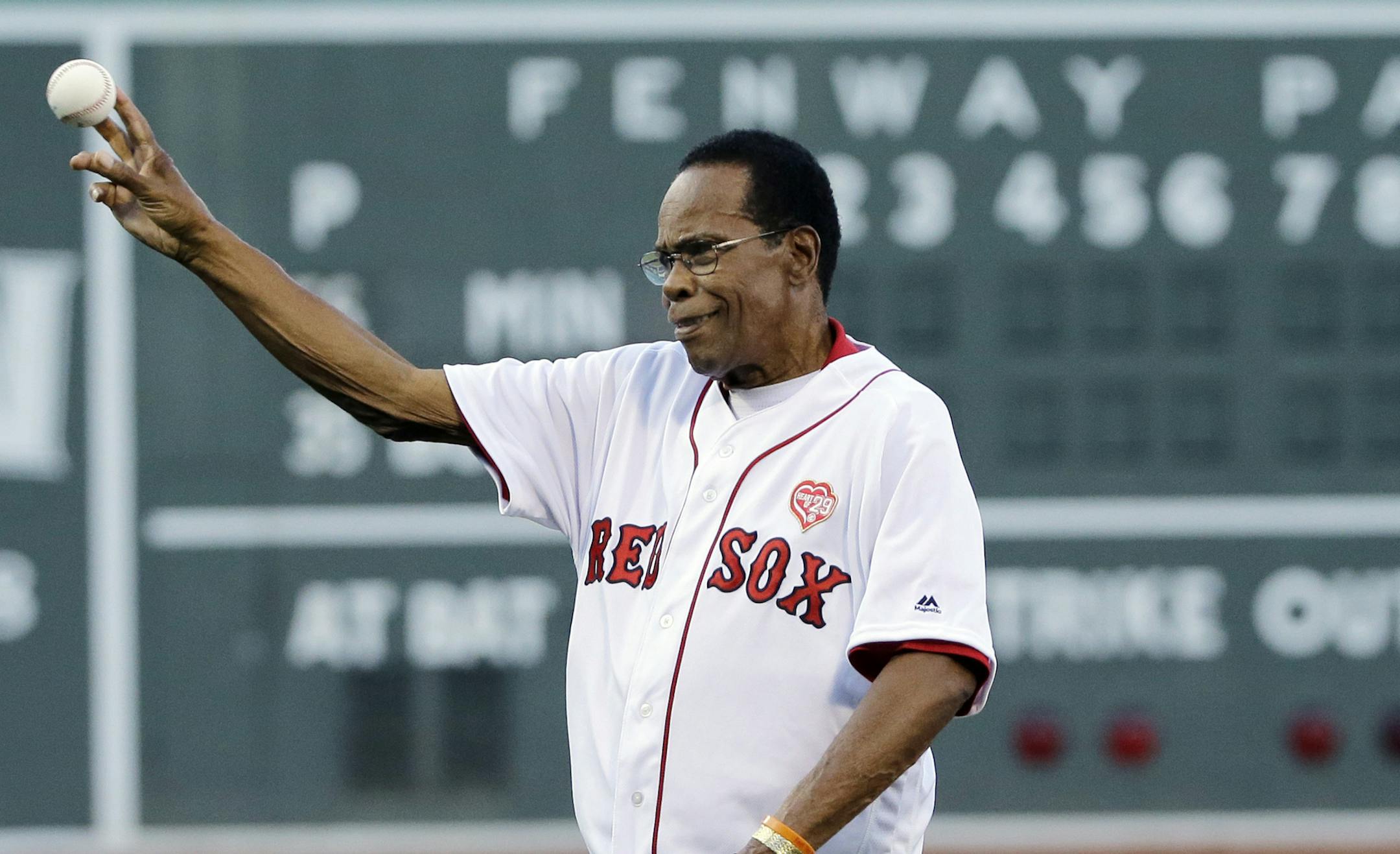 Minnesota Twins great Rod Carew throws out a ceremonial first pitch before a baseball game between the Boston Red Sox and the Minnesota Twins at Fenway Park, Thursday, July 21, 2016, in Boston. (AP Photo/Elise Amendola)