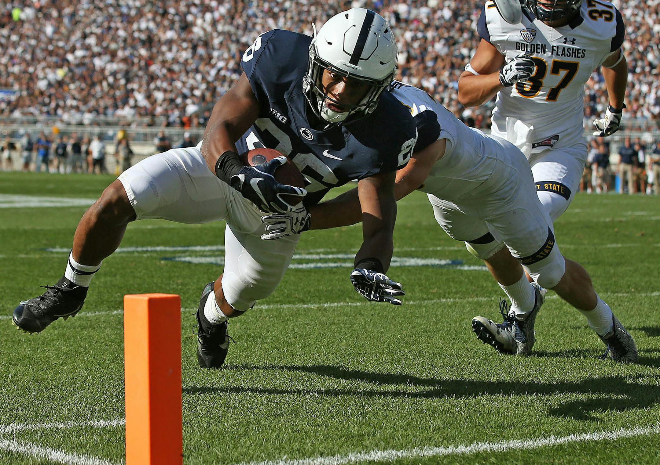 Penn State's Saquon Barkley (26) goes in for a touchdown against Kent State during the first half of an NCAA college football game in State College, Pa., Saturday, Sept. 3, 2016, (AP Photo/Chris Knight) ORG XMIT: PACK109