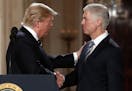 President Donald Trump shook hands with Neil Gorsuch, his pick for Supreme Court justice, in the East Room of the White House.