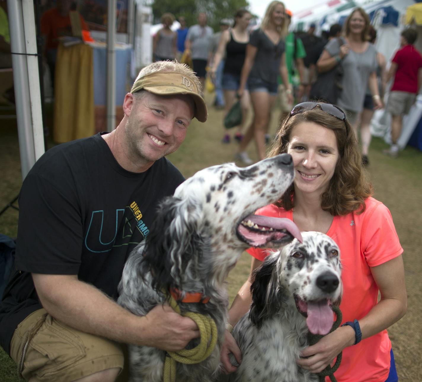 Chad SalonekÊ and Anna Erdmann, with Doc and Rogue the English Setters The 2015 Gamefair has developed from one big circus tent to a mini State fair atmosphere over its 34 years. We photographed a slice of the fair through the people that have attending this year, some who have been all 34 years. [ PHOTO BY TOM WALLACE ¥ tom.wallace2@comcast.net owfair081415: Game Fair