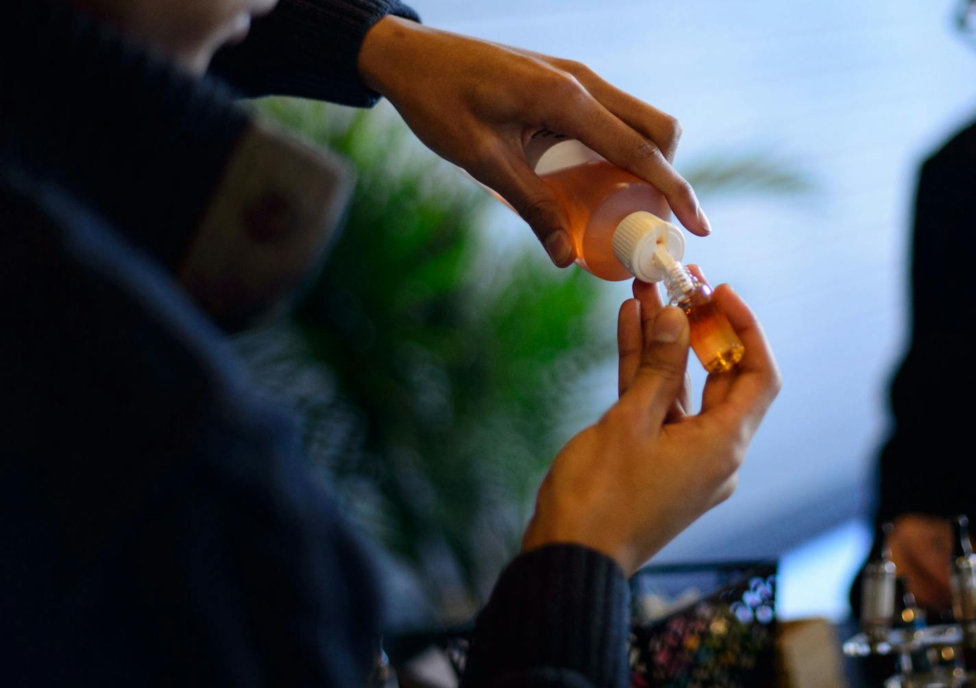 In this file photo, nicotine juice is poured for a customer at Uptown Vapor Shop in Minneapolis.