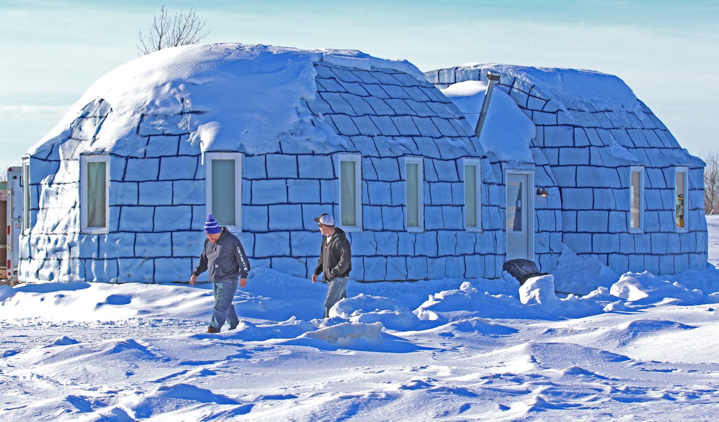 Two Lake of the Woods ice fishermen took a midday break at the Igloo Bar, a licensed cocktail lounge constructed each year on Zippel Bay.