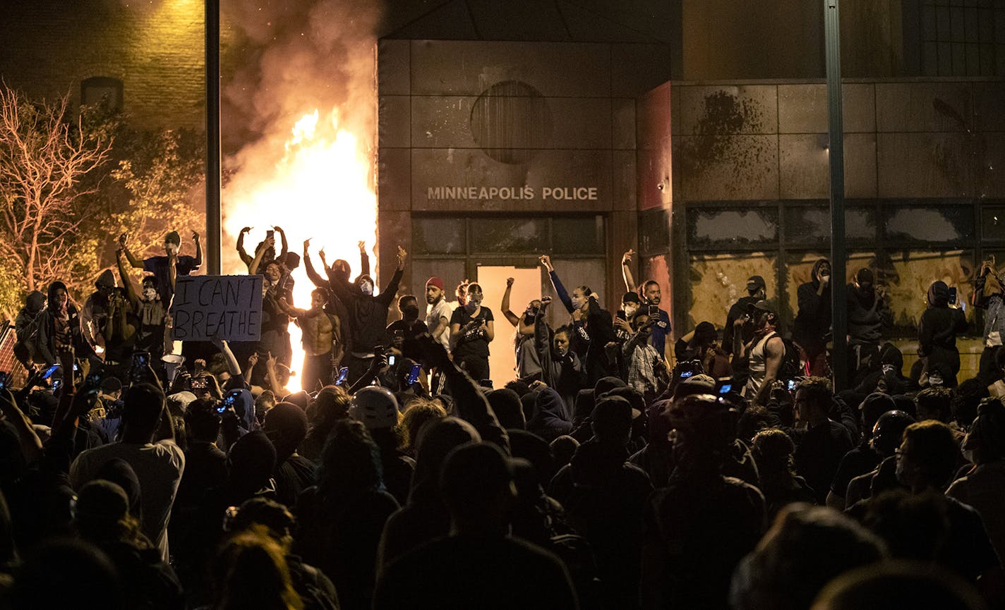 The Minneapolis Third Police Precinct is set on fire during a third night of protests following the death of George Floyd while in Minneapolis police custody, on Thursday, May 28, 2020. (Carlos Gonzalez/Minneapolis Star Tribune/TNS) ORG XMIT: 1674865