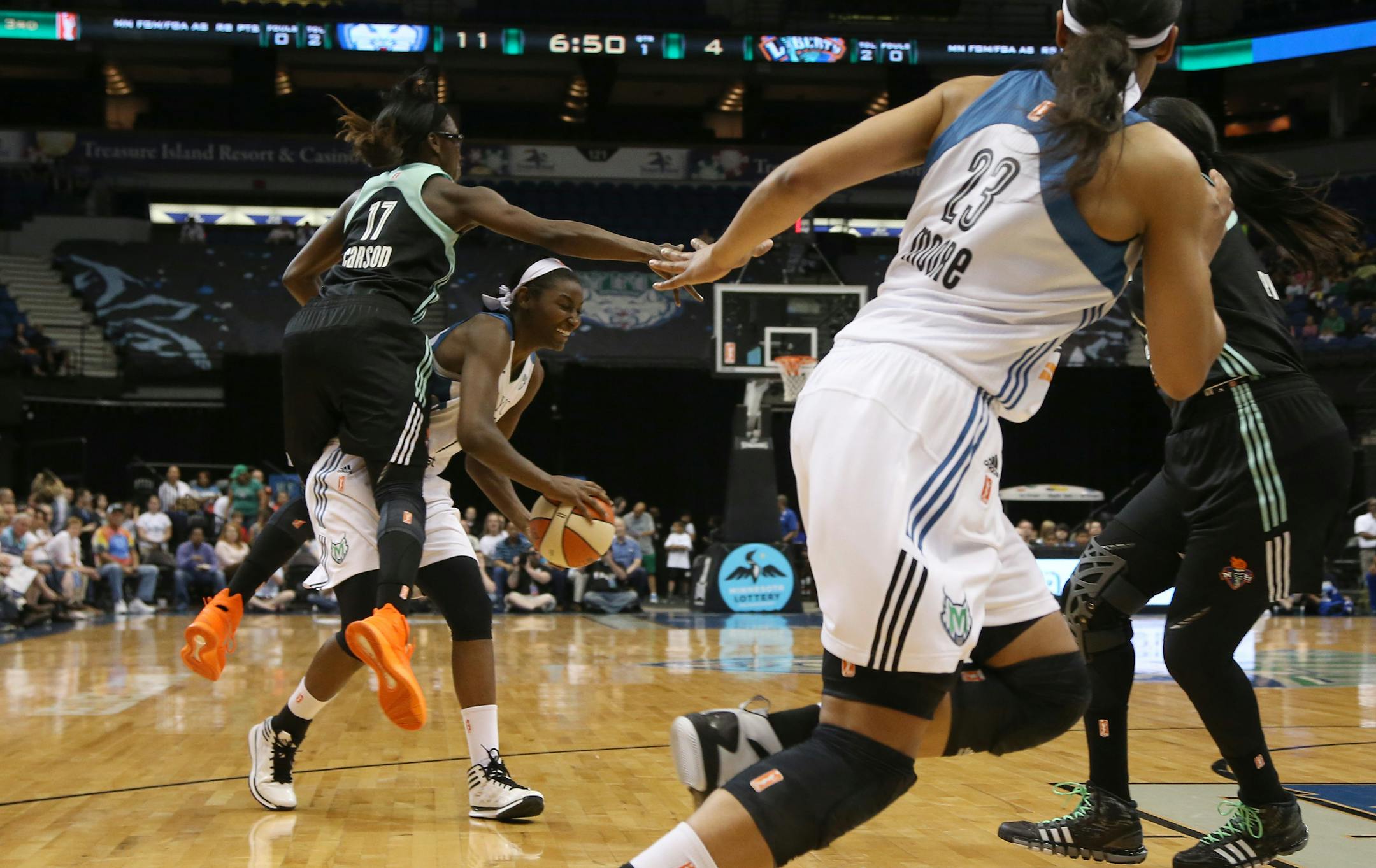 Lynx Asia Taylor got fouled while attempting to pass by Liberty's Essence Carson during the first half. ] (KYNDELL HARKNESS/STAR TRIBUNE) kyndell.harkness@startribune.com Lynx vs New York Liberty at the Target Center in Minneapolis Min. Saturday, May 24, 2014.