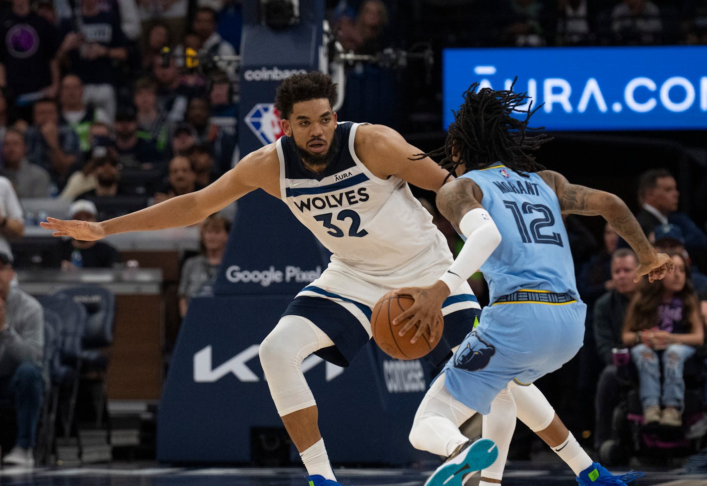 Minnesota Timberwolves center Karl-Anthony Towns (32) defended as Memphis Grizzlies guard Ja Morant (12) moved the ball upcourt Saturday night, April 23, 2022 at Target Center in Minneapolis. The Minnesota Timberwolves defeated the Memphis Grizzlies 119-118 in game 4 of their NBA first round playoff series. ] JEFF WHEELER • Jeff.Wheeler@startribune.com