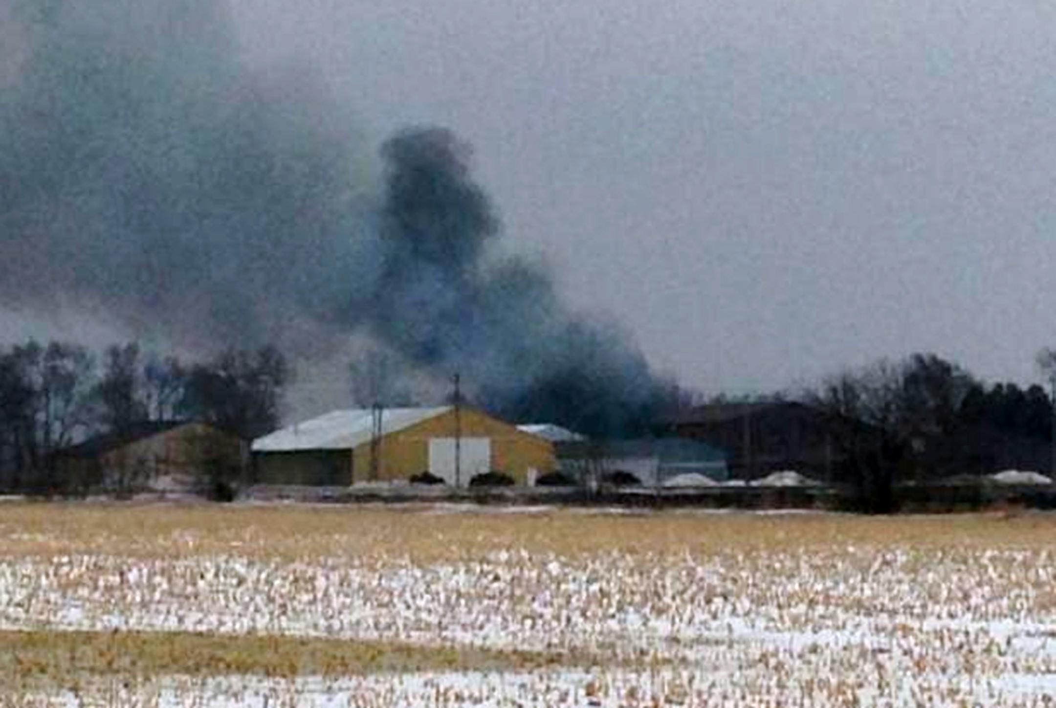 In this image from video provided by KIMT-TV smoke rises from a fire in Northwood, Iowa, Thursday, Feb. 20, 2014. Authorities say an evacuation order is in place for Northwood due to a fire at a fertilizer plant at Northwood Municipal Airport.