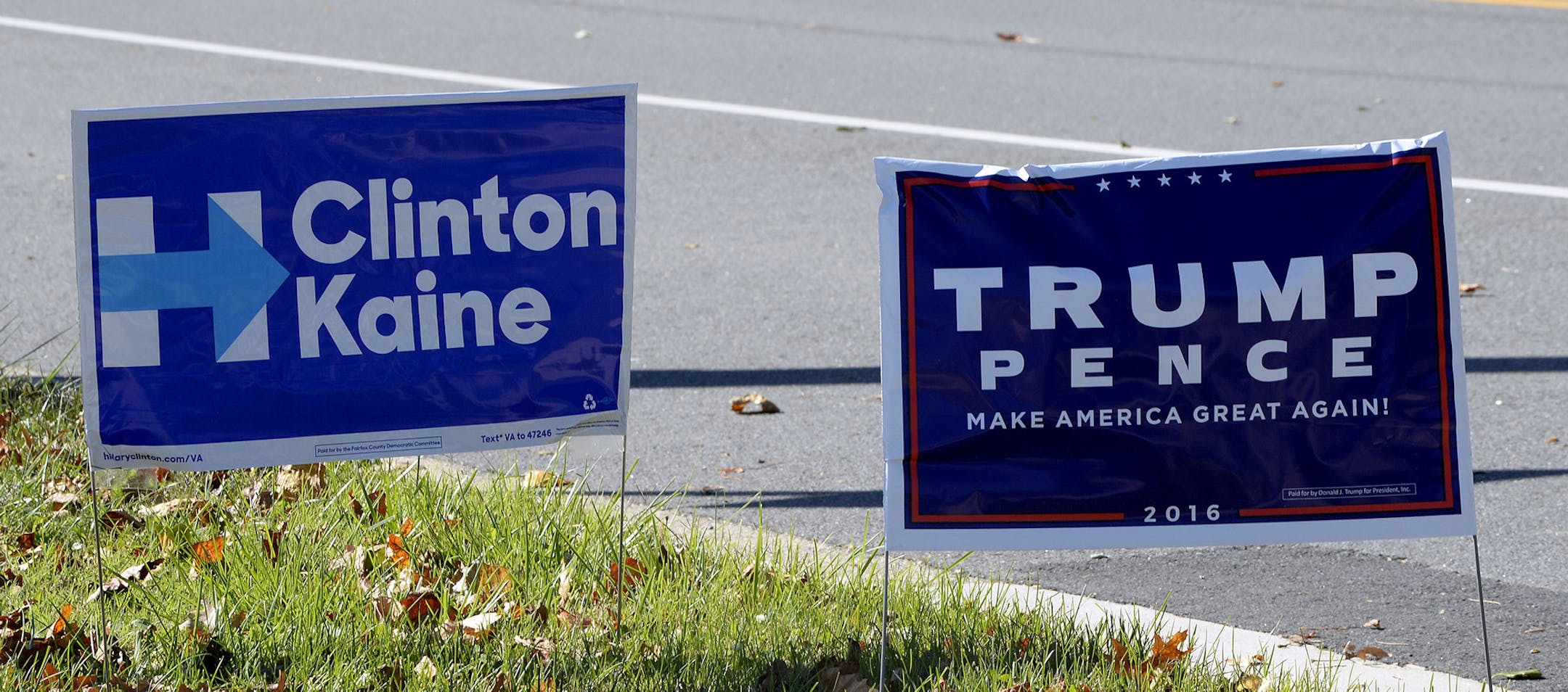 A Republican Presidential candidate Donald Trump campaign sign and a Democartic Presidential candidate Hillary Clinton sign are posted on a road 10 days away from the 2016 presidential election, in Mclean, Virginia on October 28 2016. Photo by Olivier Douliery/Abaca ORG XMIT: 569030_012