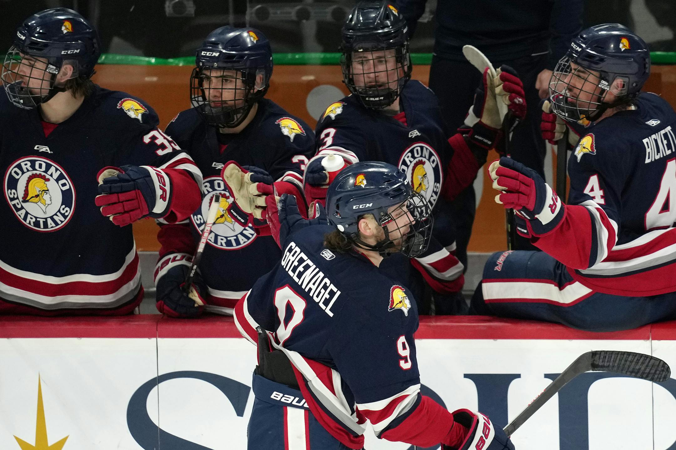 Orono forward Joseph Greenagel (9) celebrates after scoring on Warroad goaltender Hampton Slukynsky (1) in the second period.