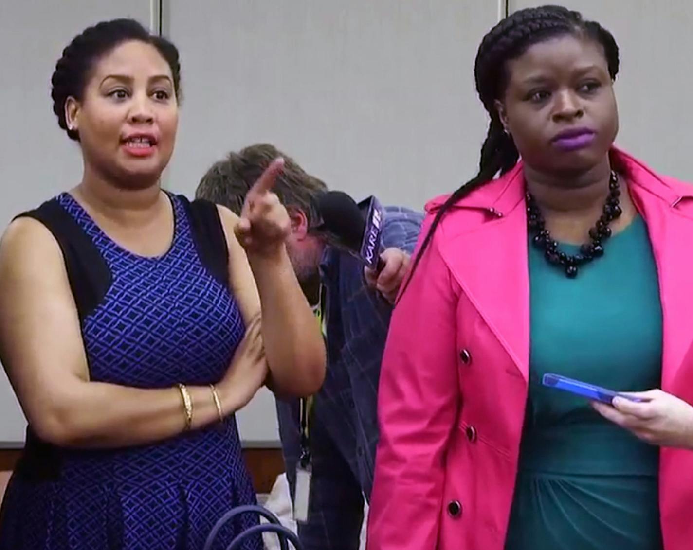 One of the community activists at the press conference, standing in the middle, said to Hennepin County Attorney Mike Freeman, "If the city burns, it's on your hands." ] SHARI GROSS/STAR TRIBUNE