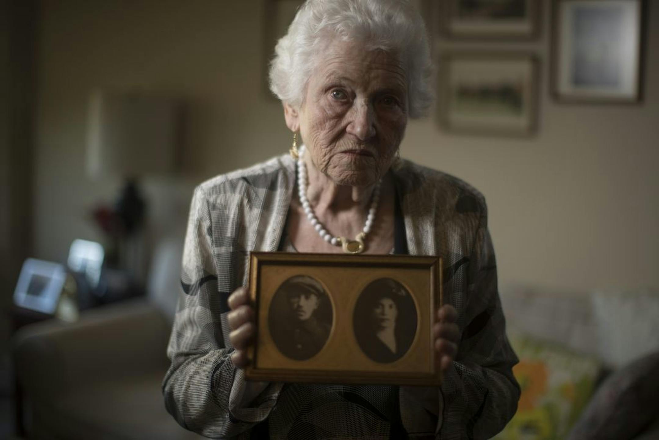 Holocaust survivor Judy Meisel of St. Louis Park held a photo of her parents Osser Beker (father) and Mika Beker (mother) that was taken around 1938.