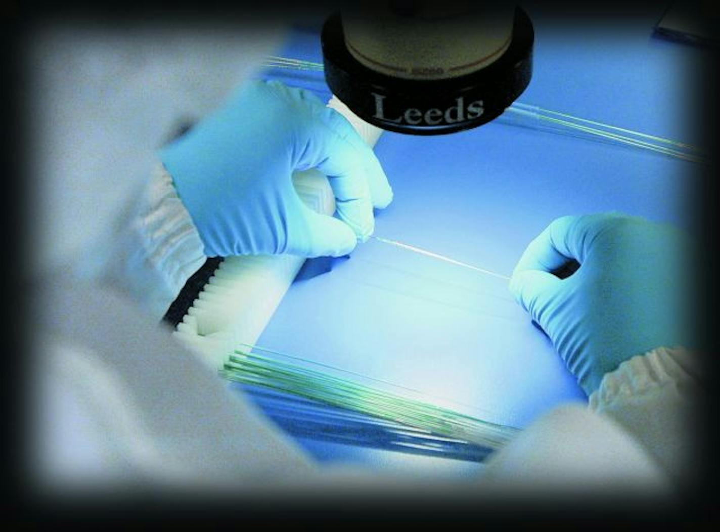 A worker inspects the Express2 Stent delivery systems at Boston Scientific, a worldwide developer, manufacturer and marketer of medical devices whose products are used in a broad range of interventional medical specialties.