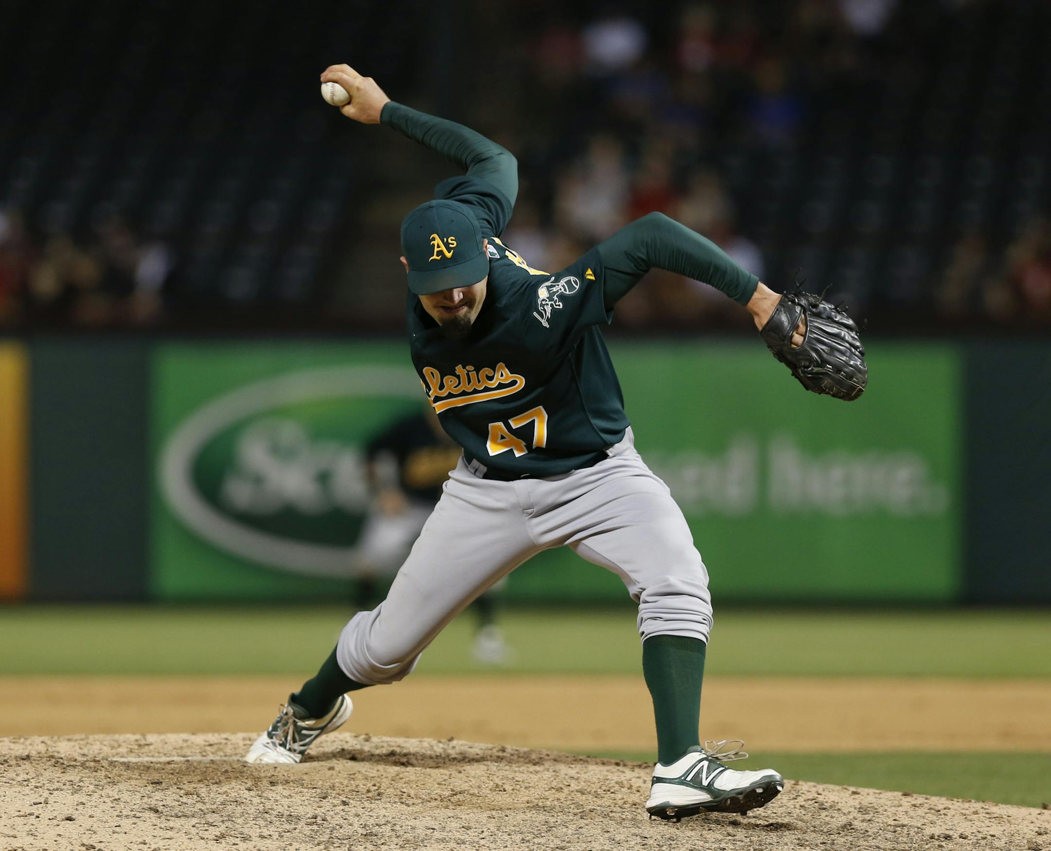 Oakland Athletics relief pitcher Pat Neshek (47) delivers to the Texas Rangers during a baseball game, Monday, May 20, 2013, in Arlington, Texas. (AP Photo/Jim Cowsert) ORG XMIT: OTKJC113
