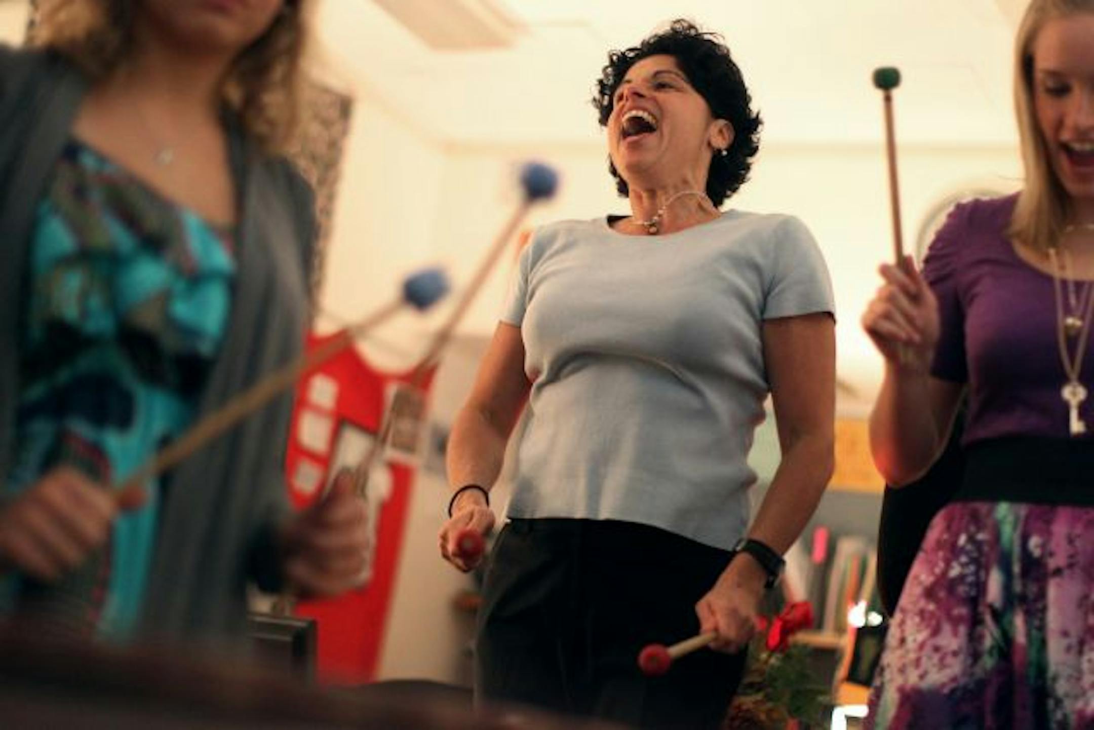 Carey Sirianni, academic resource instructor at the Breck School, led a group of students in a recent marimba band practice.