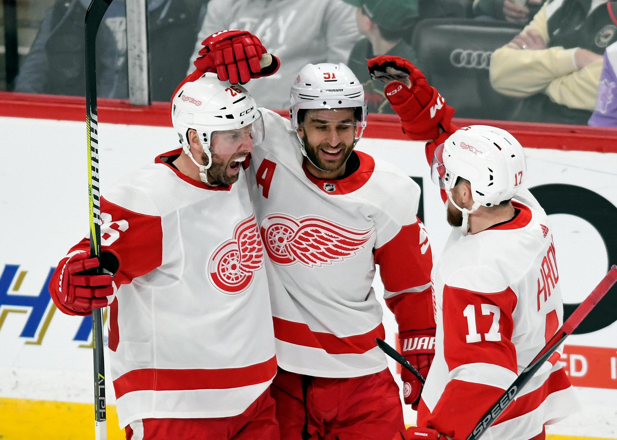 Detroit Red Wings' Frans Nielsen, center, of Denmark, and Filip Hronek (17), of the Czech Republic, congratulate Thomas Vanek, left, of Austria, after he scored a goal against the Minnesota Wild during the second period of an NHL hockey game Saturday, Jan. 12, 2019, in St. Paul, Minn. (AP Photo/Tom Olmscheid)