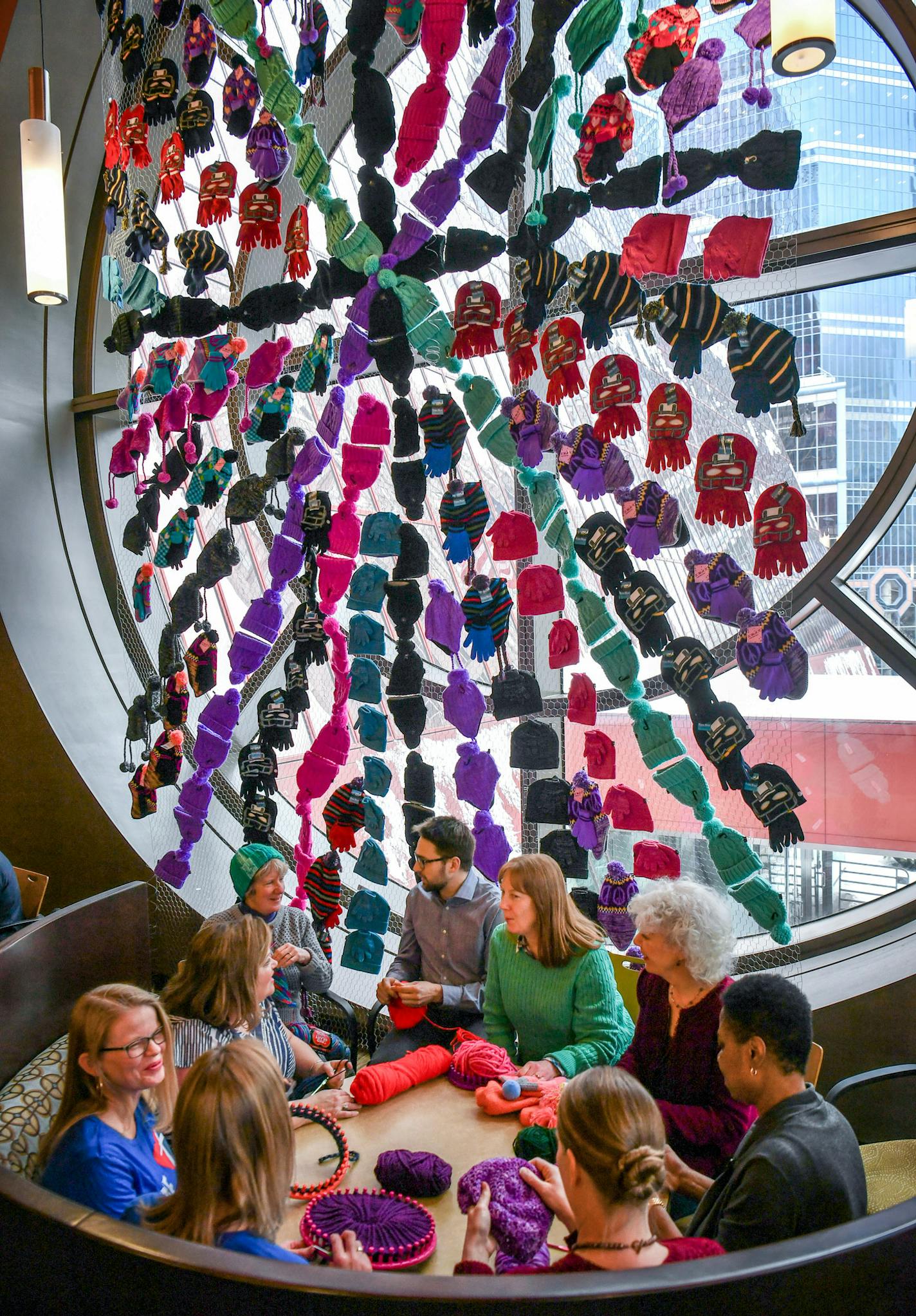 Nine members of Get Stitchy gathered at Thrivent where they knitted or crocheted hats and mittens in an effort to donate 5200 items for their Super Bowl charity event. ] GLEN STUBBE &#xef; glen.stubbe@startribune.com Thursday, January 25, 2018