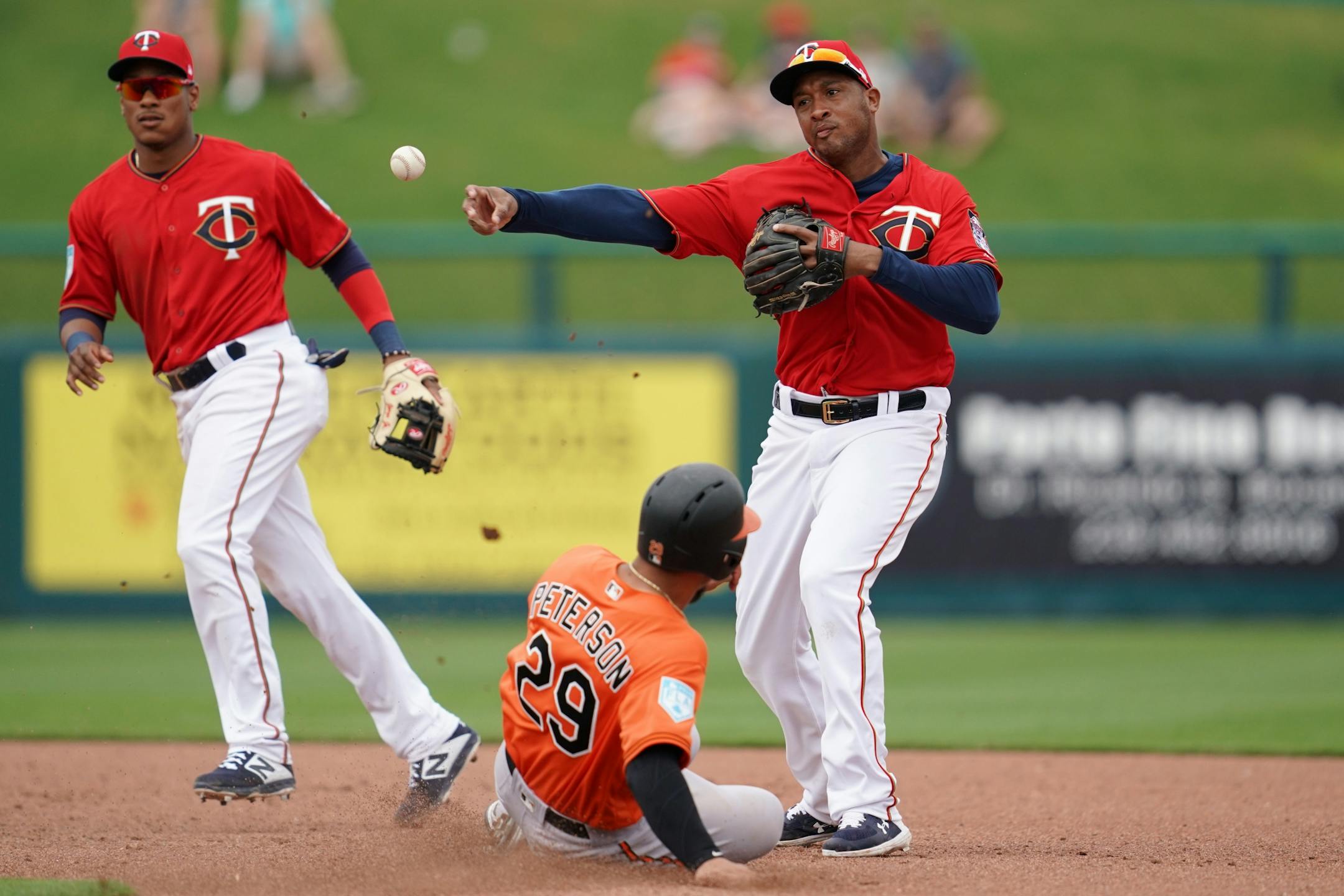 Minnesota Twins second baseman Jonathan Schoop (16) tagged out Baltimore Orioles first baseman Jace Peterson (29) as he threw to first to get the double play during Monday's game against the Baltimore Orioles.