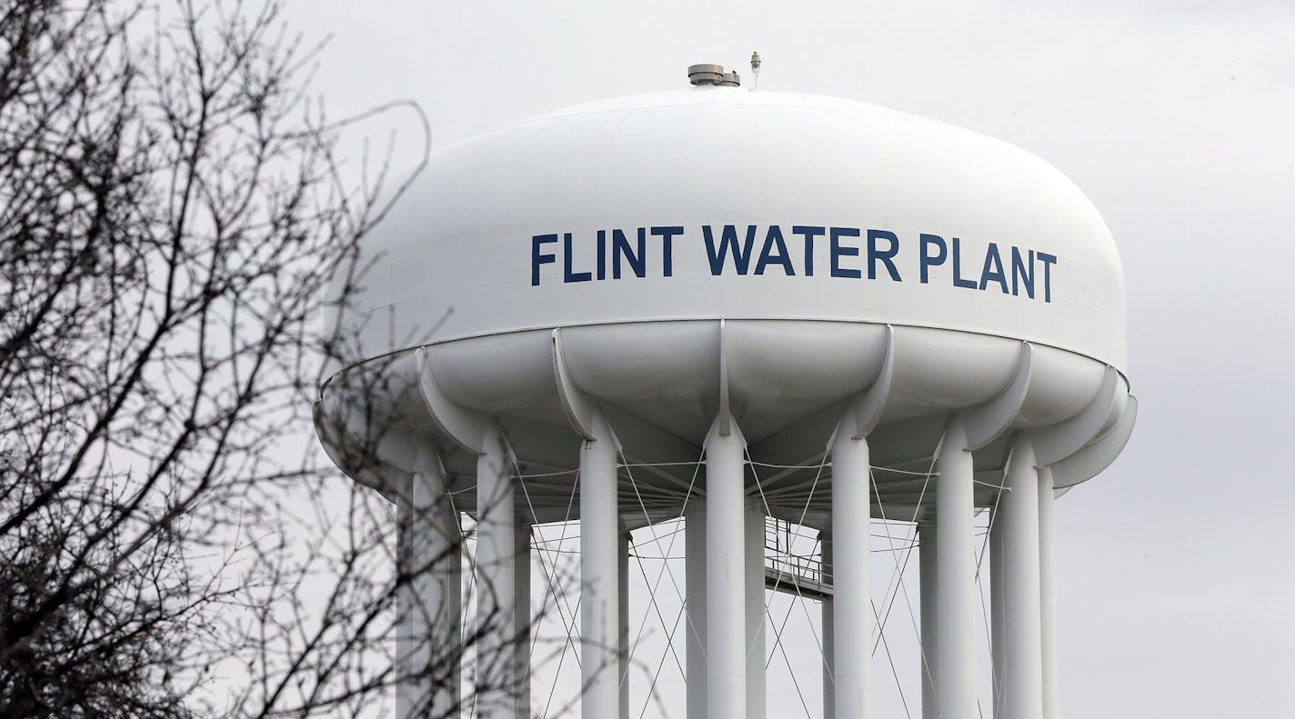 FILE - This Feb. 5, 2016 file photo shows the Flint Water Plant tower in Flint, Mich. Michigan, seeking to prevent another oversight fiasco after lead poisoning in Flint and a deadly Legionnaires' disease outbreak in the area, is considering new water testing rules for hospitals and possible changes to how large facilities manage their water systems that could include new monitoring requirements. (AP Photo/Carlos Osorio, File) ORG XMIT: MIN2016021913085262