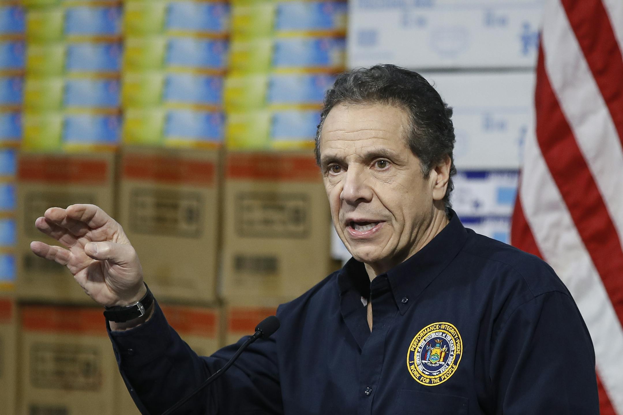 New York Gov. Andrew Cuomo speaks during a news conference against a backdrop of medical supplies at the Jacob Javits Center that will house a temporary hospital in response to the COVID-19 outbreak, Tuesday, March 24, 2020, in New York. Cuomo sounded his most dire warning yet about the coronavirus pandemic, saying the infection rate in New York is accelerating and the state could be as close as two weeks away from a crisis that projects 40,000 people in intensive care. (AP Photo/John Minchillo)