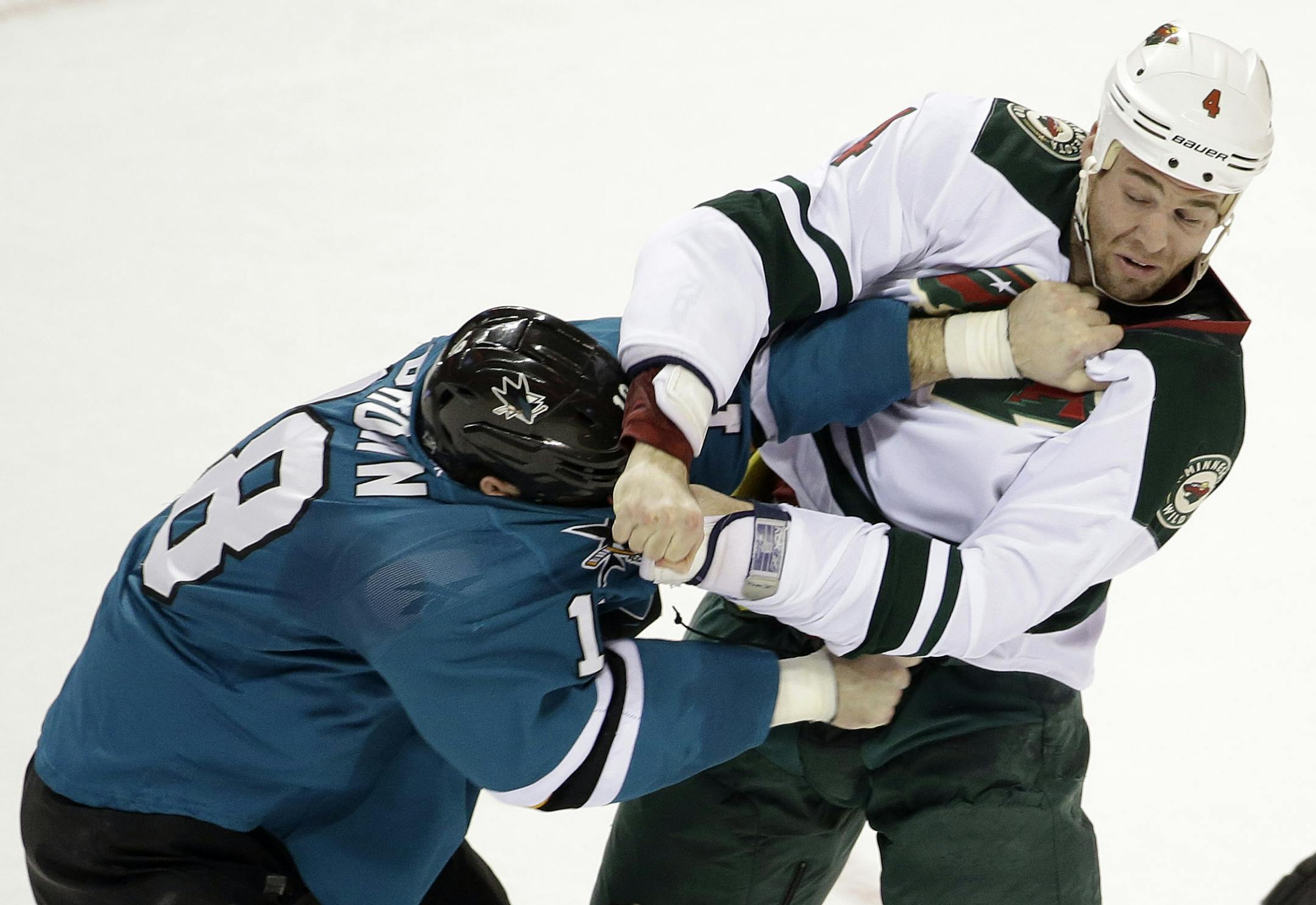 Wild defenseman Clayton Stoner, right, is week-to-week with what General Manager Chuck Fletcher said is a sprained knee.