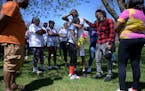 Surrounded by friends and family, Ladavionne Garrett shared an emotional embrace with Dorice Jackson at a prayer vigil for their 10-year old son, who 