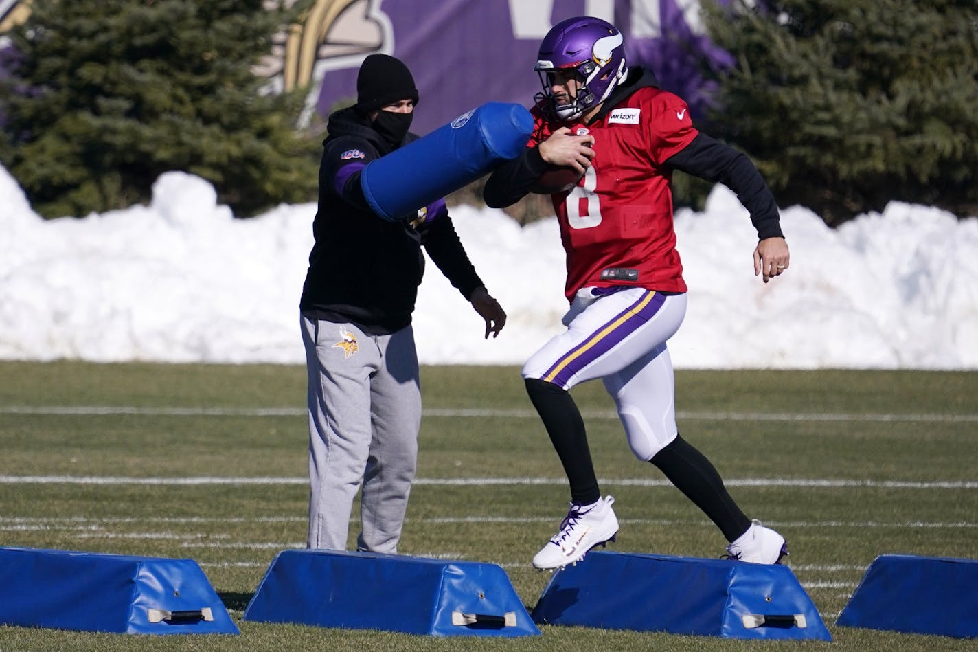 Minnesota Vikings quarterback Kirk Cousins (8) ran through a drill during practice Wednesday.