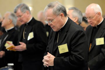 FILE - In this Monday, Nov. 10, 2008 file photo, Bishop Michael J. Hoeppner of Crookston, Minn. prays during a semi-annual meeting of the United State