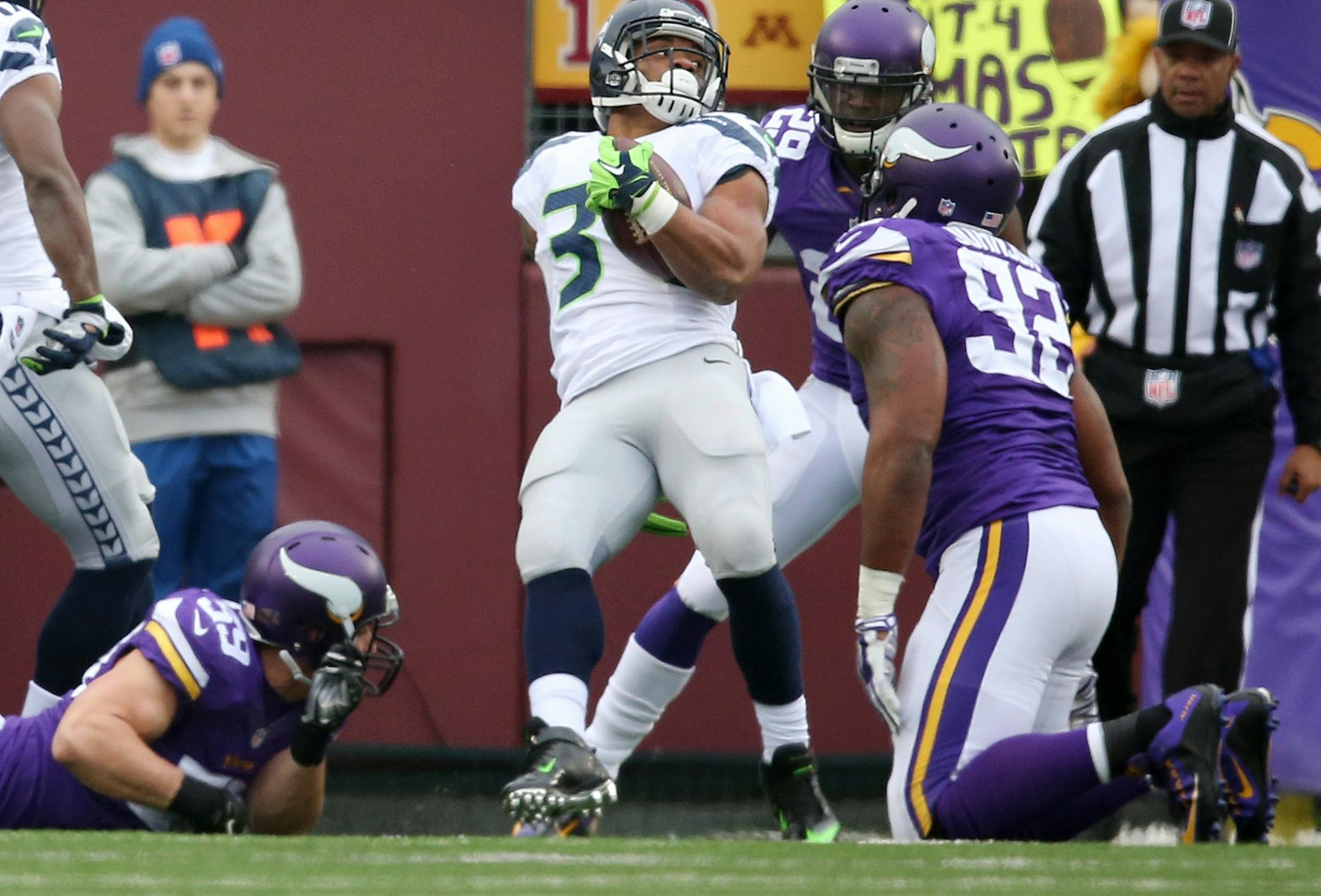 Seattle Seahawks running back Thomas Rawls (34) spun into the end zone for a first quarter touch down Sunday December 6, 2015 in Minneapolis, MN.