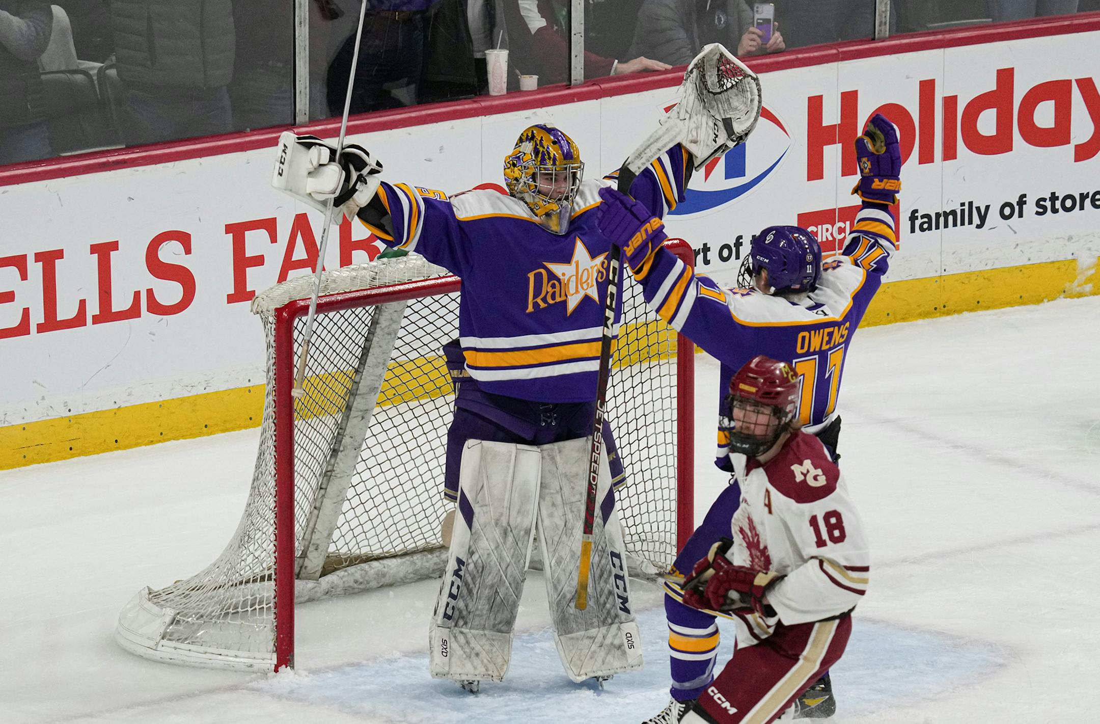 Cretin-Derham Hall Cretin-Derham Hall goaltender Leo Miller (35) and Cretin-Derham Hall forward Charles Owens (11) celebrate at the end of the game.