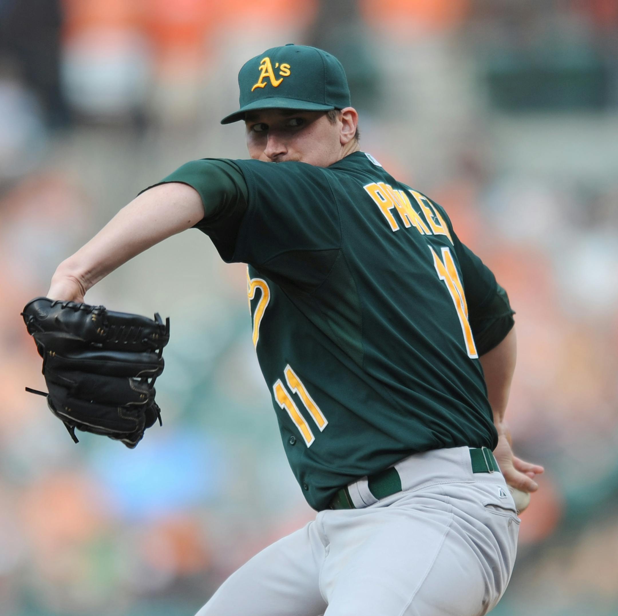 Oakland Athletics pitcher Jarrod Parker delivers against the Baltimore Orioles in the fifth inning of a baseball game, Saturday, Aug. 24, 2013 in Baltimore.(AP Photo/Gail Burton)