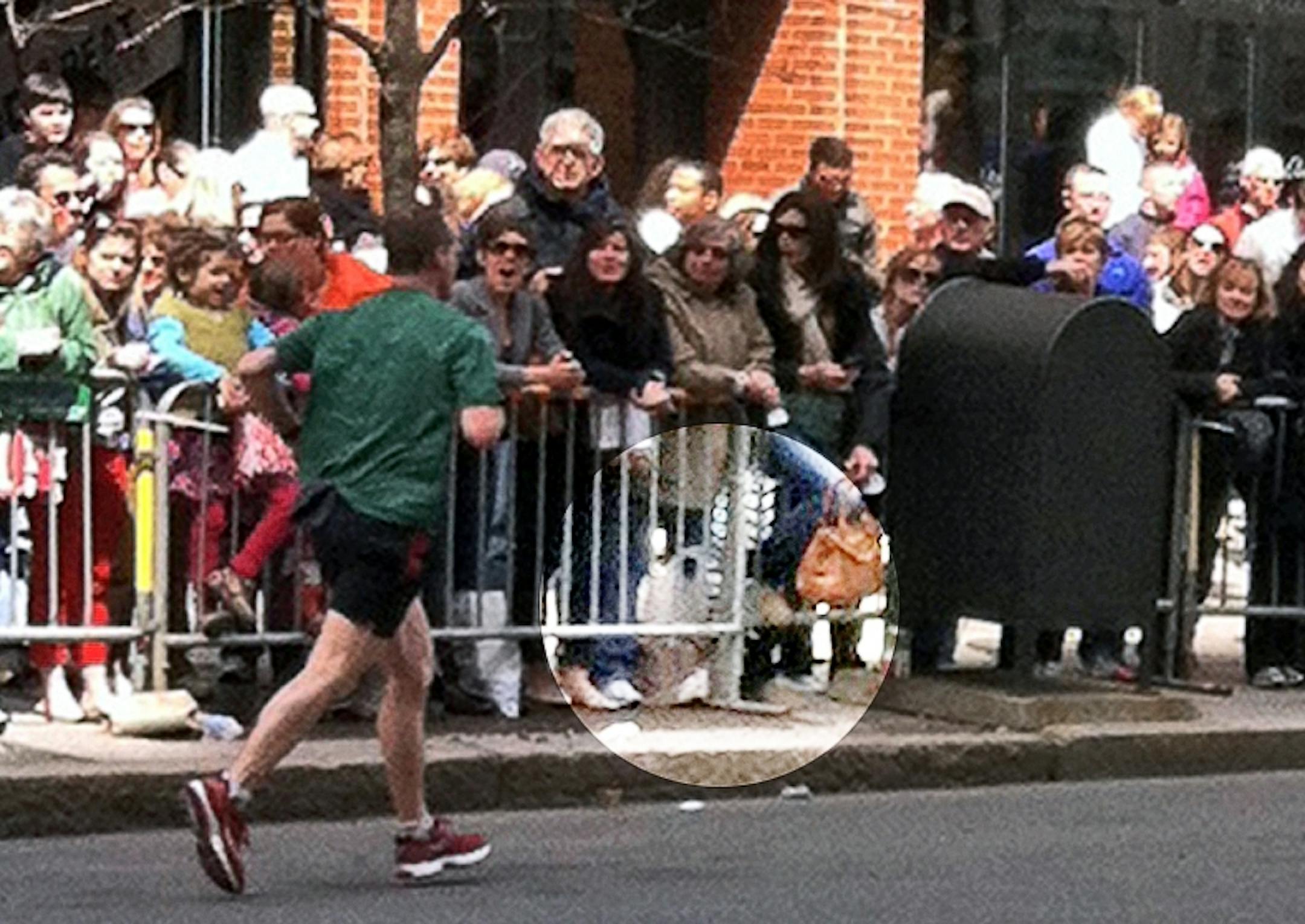 Sartell resident Sam Nordby took this picture a little more than 30 minutes before the Boston Marathon blast. Nordby's wife was in the race and he shot the photo from across the street as runners passed. The suspect bag is highlighted.