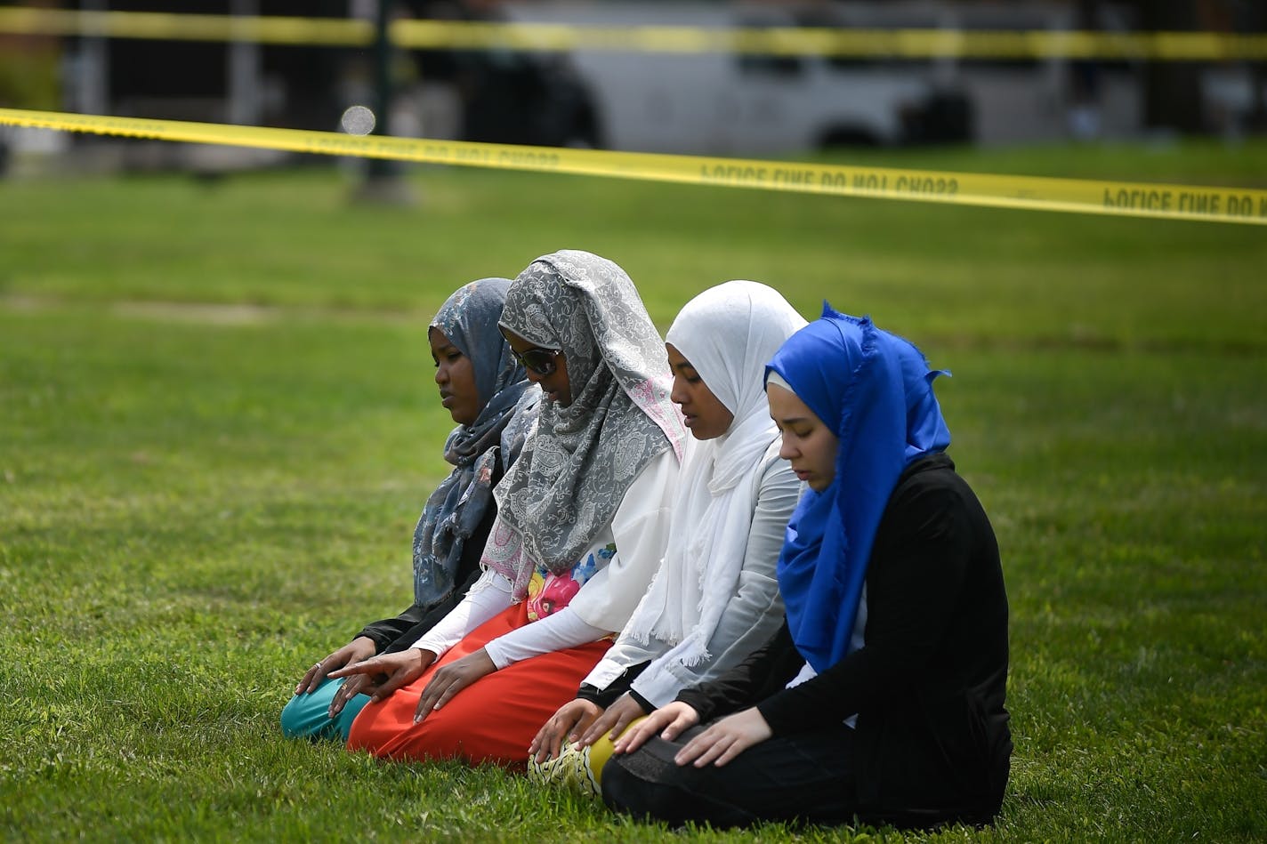 A group of women took part in Saturday afternoon prayers led by Dar Al Farooq Islamic Center Executive Director Mohamed Omar hours after an explosion at the center in Bloomington.