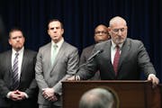 U.S. Attorney Andrew Luger, at podium, announced charges Monday against 10 more people in the ongoing $250 million federal food aid fraud case involvi