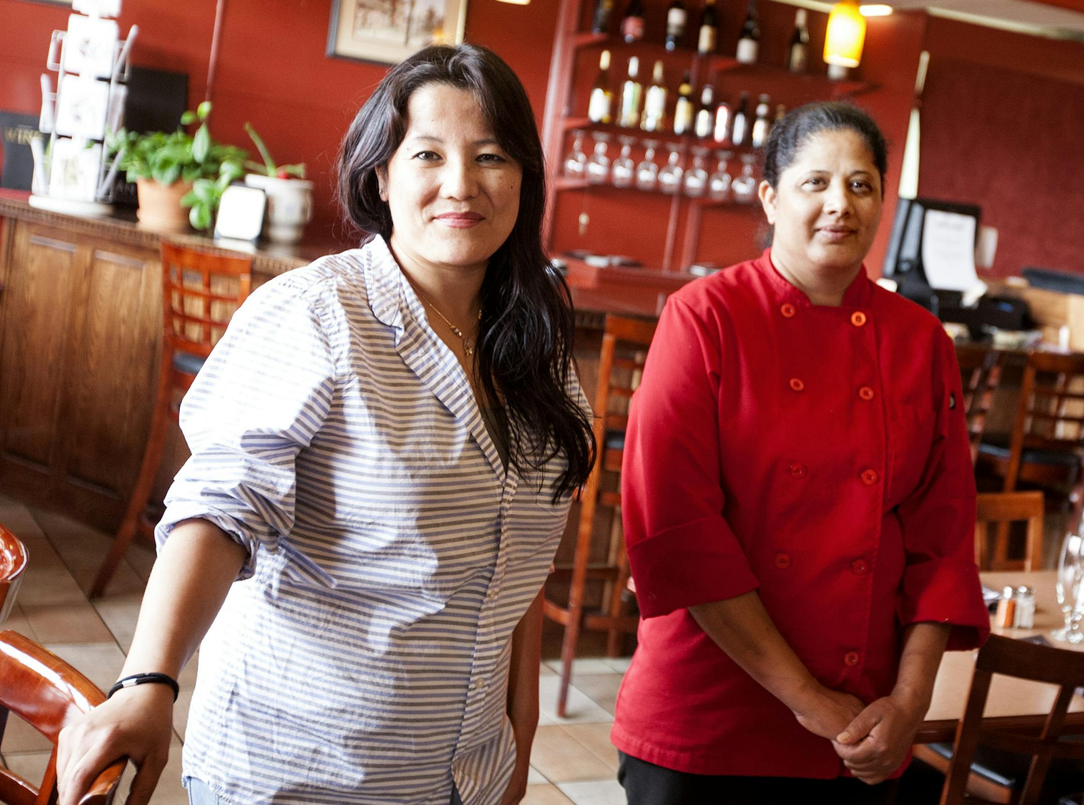 Rashmi Bhattachan, left, and Sarala Kattel of Gorkha Palace began cooking Nepali, Indian and Tibetan cuisine at farmers markets. Photographed at their restaurant in Minneapolis June 12, 2014. (Courtney Perry/Special to the Star Tribune)