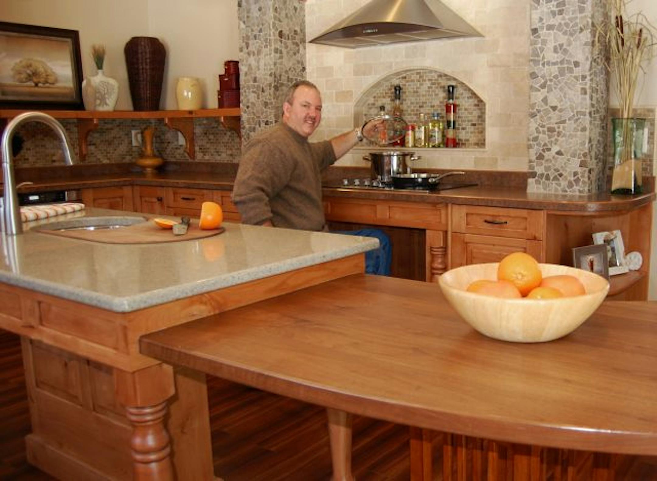 provided photo / credit: Brianna Tolman Universal0725, - Rod Tolman in the 'universal' kitchen of his Bemidji home.