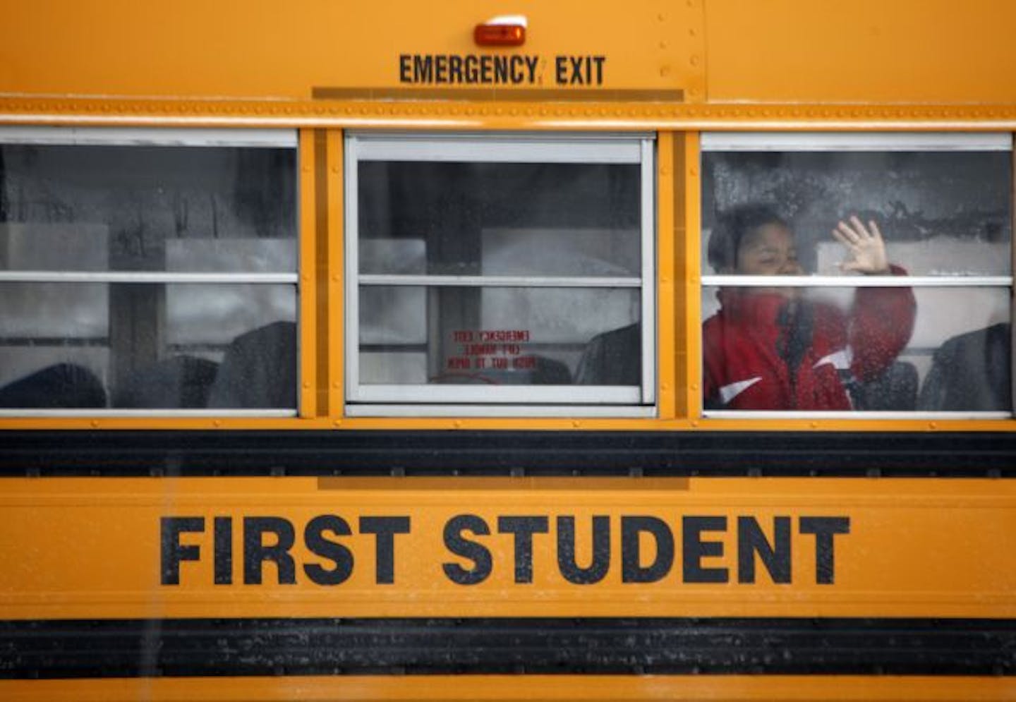 St. Paul public education will shift toward community schools in a money-saving plan that was announced Tuesday morning. The four-year plan, if approved by the School Board, will end citywide transportation for a majority of its students, phase out 16 magnet programs and close two elementary schools. (IN THIS PHOTO) A student waits for the bus ride home outside FOur Seasons Elementary in St. Paul Tuesday afternoon.