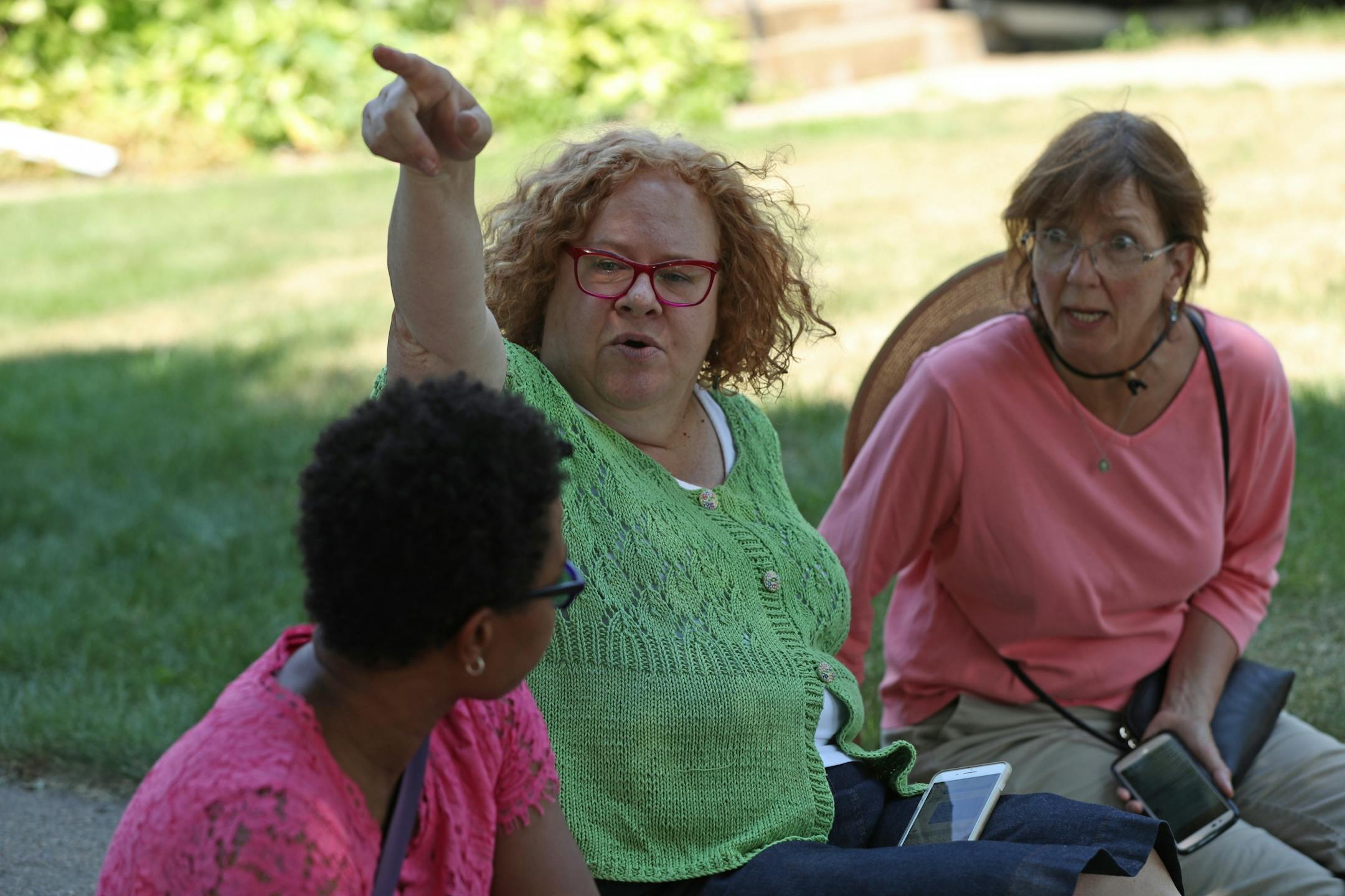 (From left to right) Janis Shearer, Elizabeth Watkins and Mary Gebhart discussed what they witnessed after a natural gas explosion caused Minnehaha Academy's north campus buildings to collapse. Watkins lives across the street from the school and heard children screaming right after the explosion. She ran over to the scene and saw kids on the soccer field running away from the school.