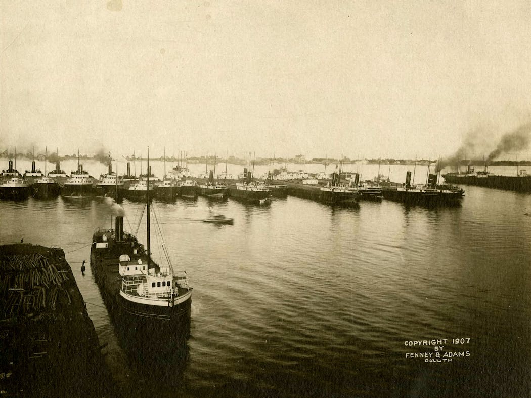 Freighters waiting to visit the ore and coal docks at Duluth's harbor in 1907.