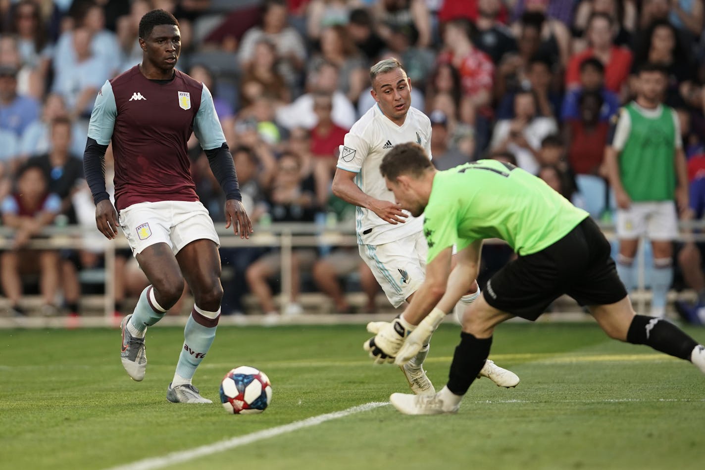 Aston Villa goalkeeper Jed Steer (12) intercepted a scoring attempt by Minnesota United midfielder Miguel Ibarra (10) during the Premier League team's friendly on July 17 at Allianz Field in St. Paul. Aston Villa won the match 3-0.