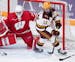 Minnesota forward Grace Zumwinkle (12) tacked a loose puck in front of Wisconsin goaltender Kennedy Blair (29) in the second period. ] ANTHONY SOUFFLE
